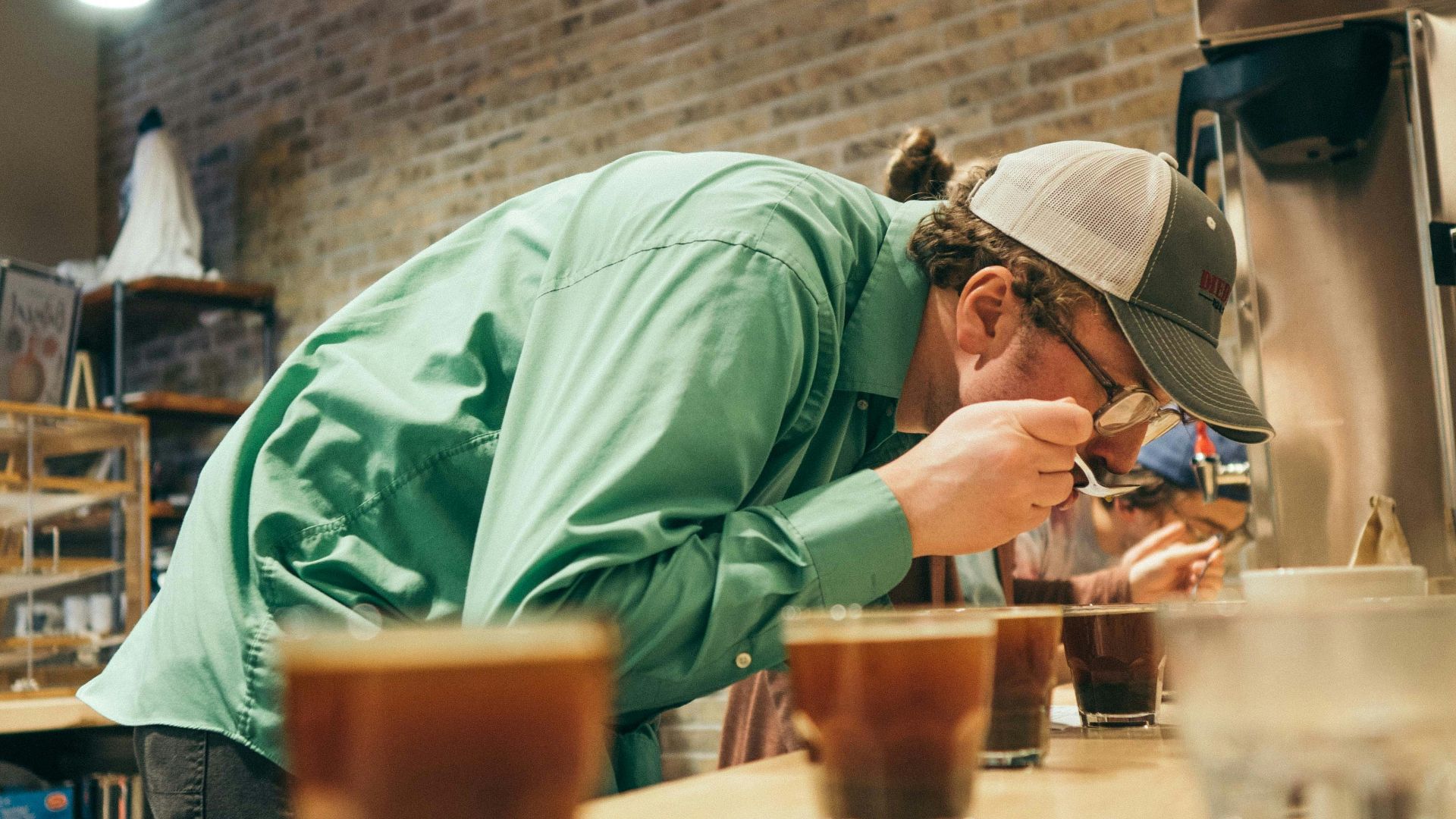 person drinking in a room close-up photography