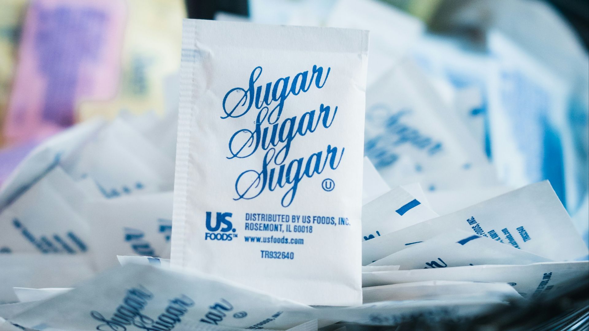 white and blue plastic pack on white paper