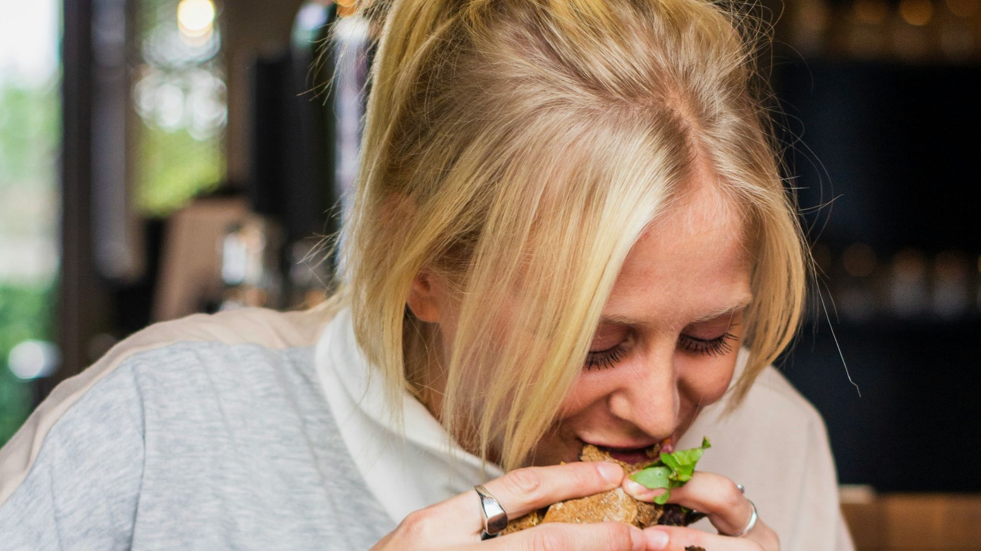 woman eating burger