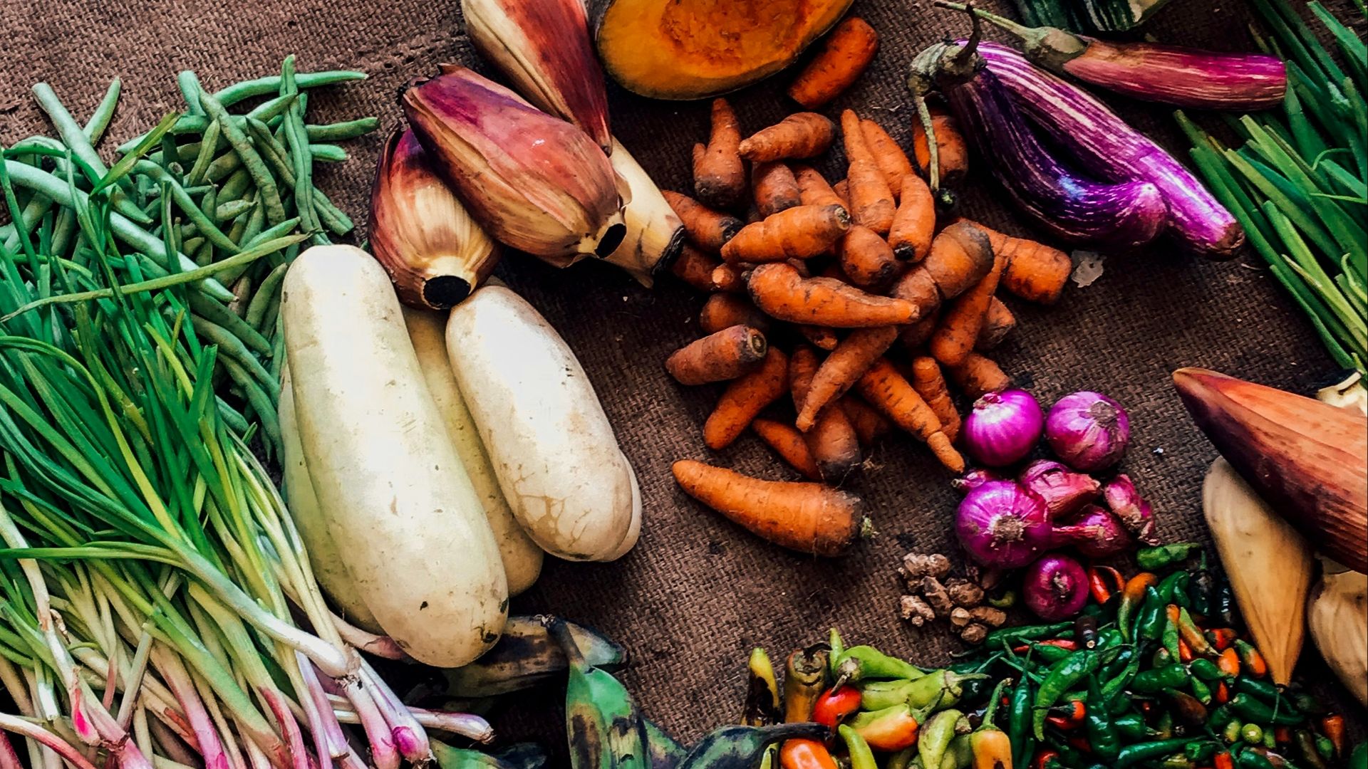 assorted vegetables on brown textile