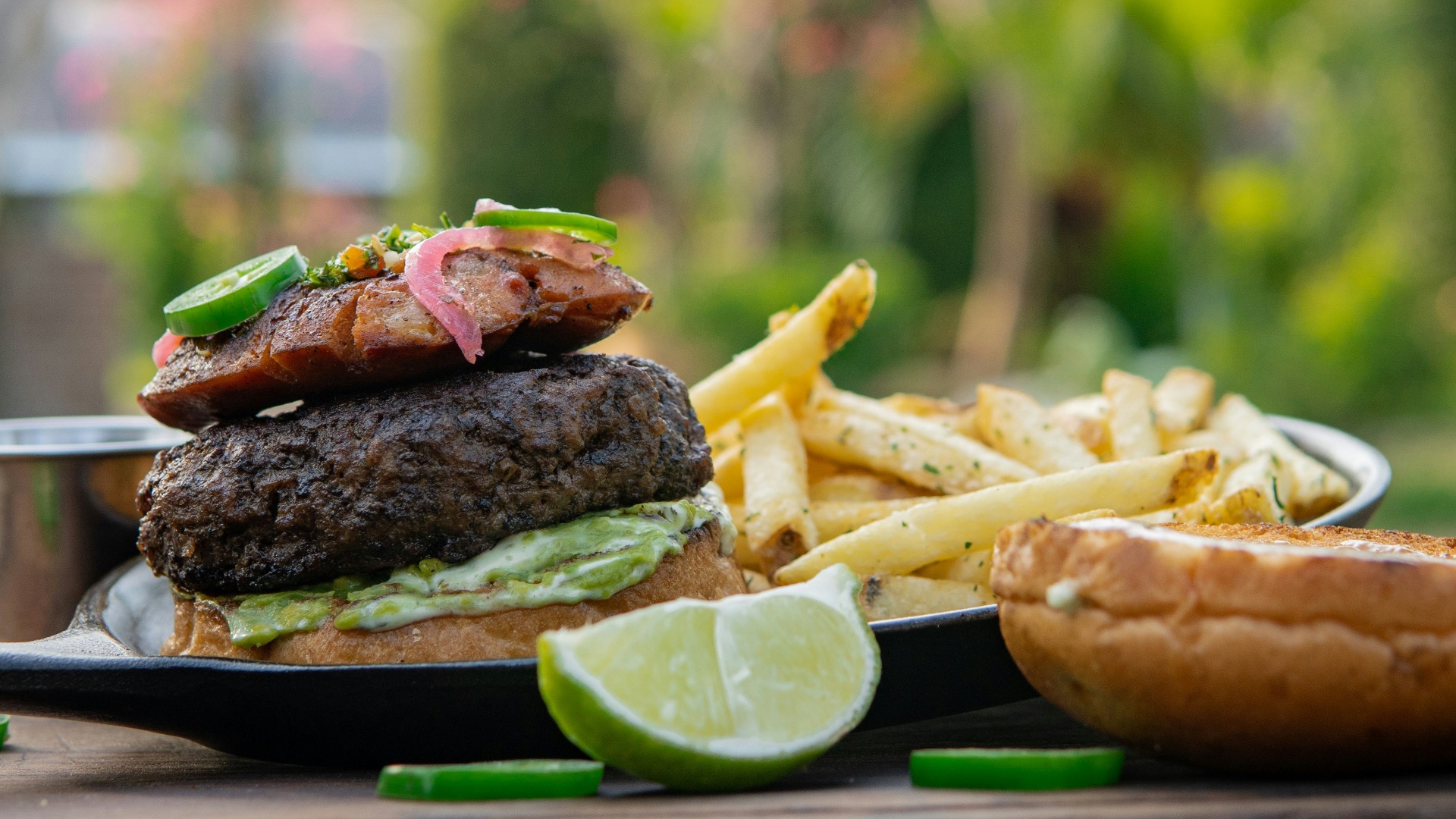 burger and fries on black plate