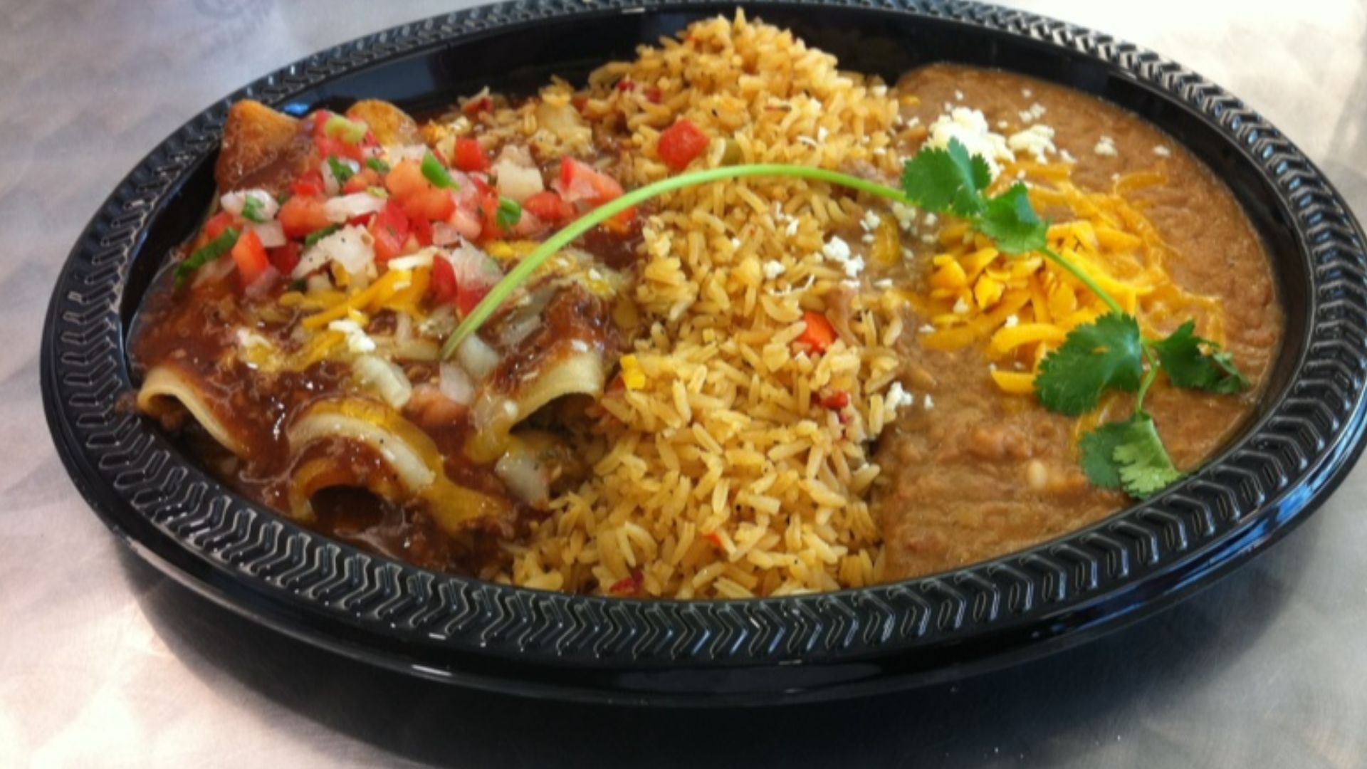 File:Beef enchiladas, rice and refried beans.jpg