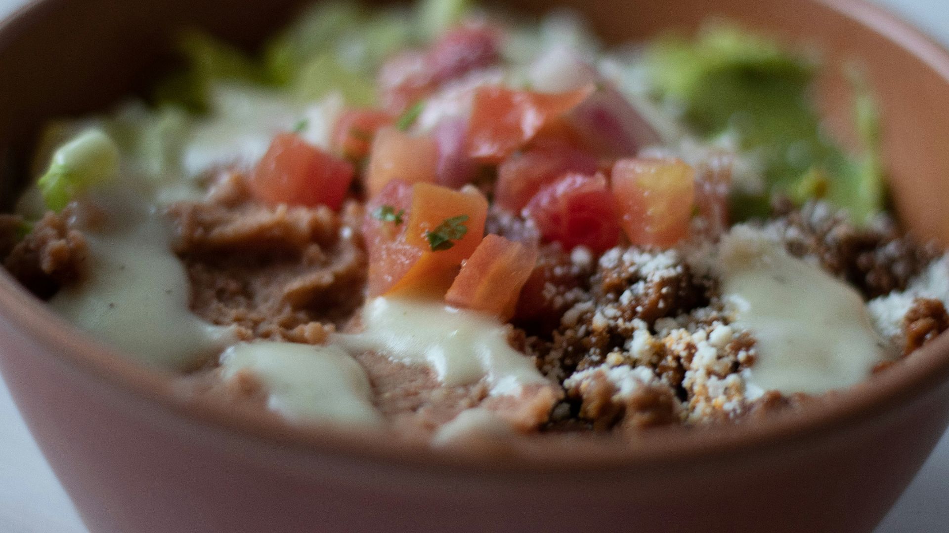 a close up of a bowl of food on a table