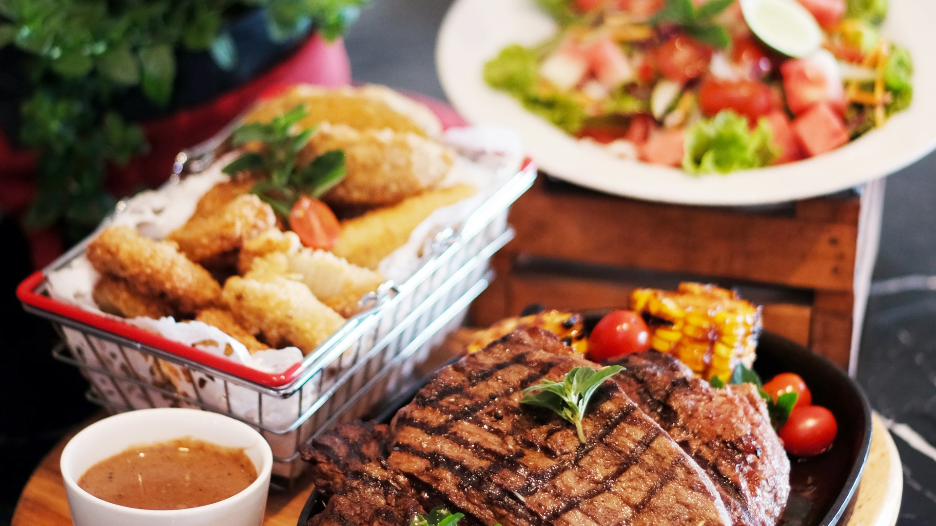 grilled meat with vegetable on brown wooden round tray