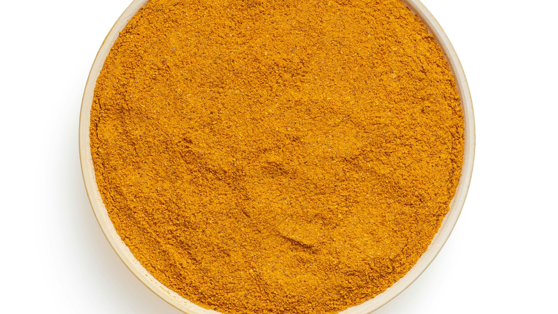 round brown powder on white surface