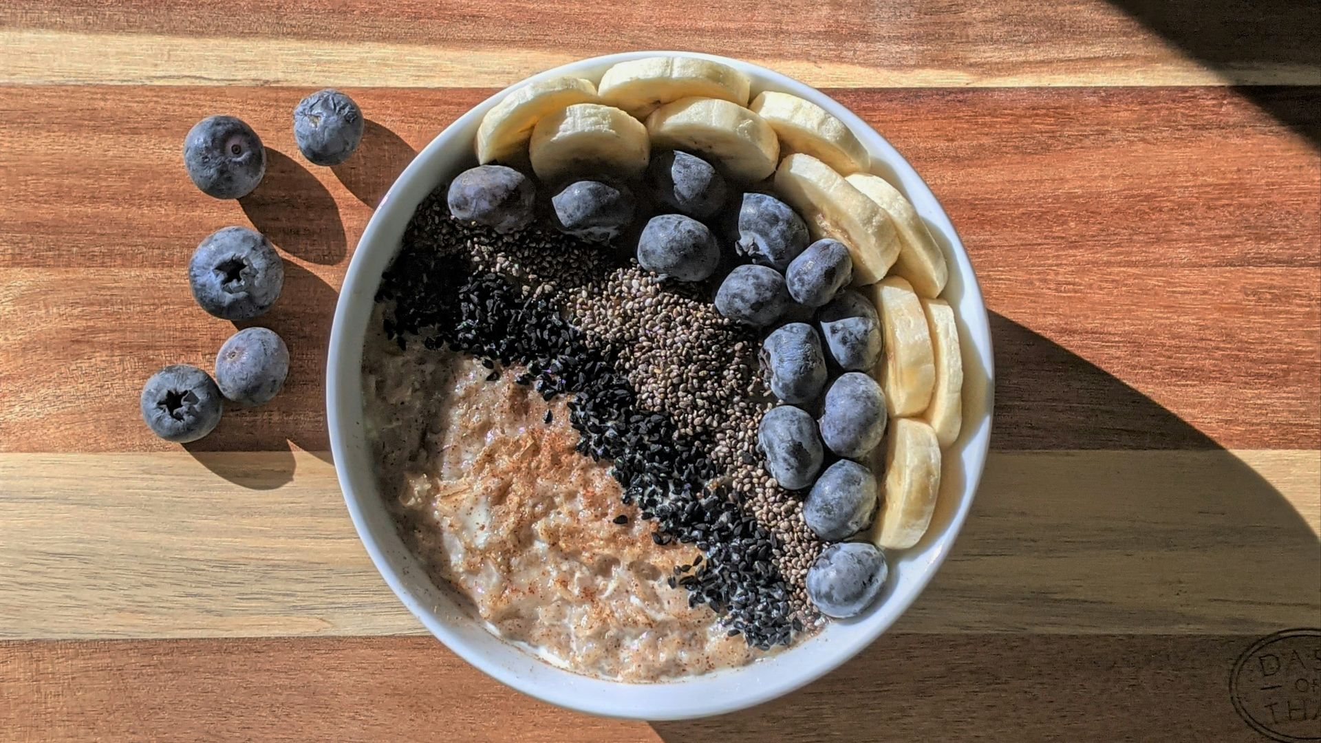 brown and black beans in white ceramic bowl