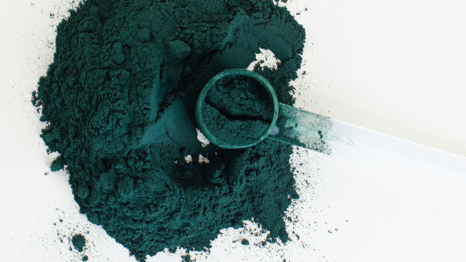 a close-up of a syringe with green liquid