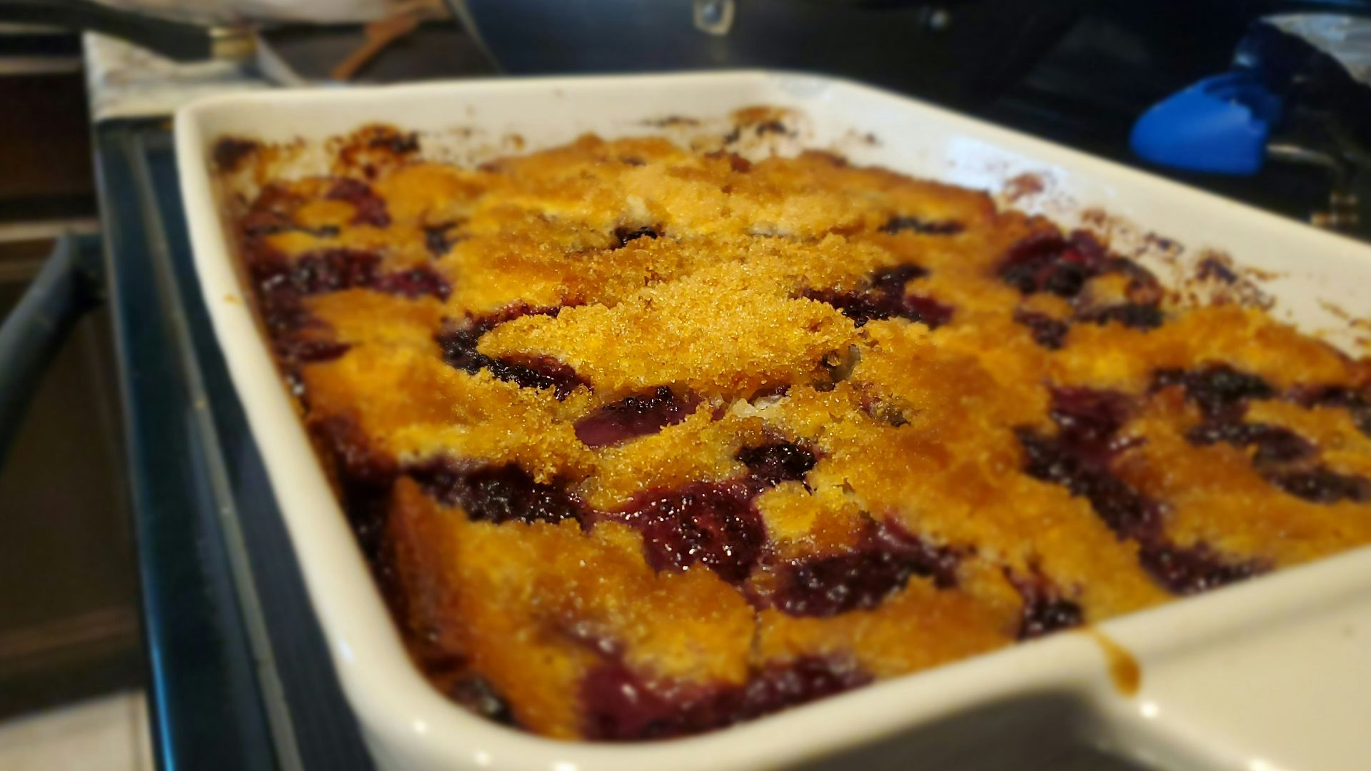 A casserole dish with blueberries in it