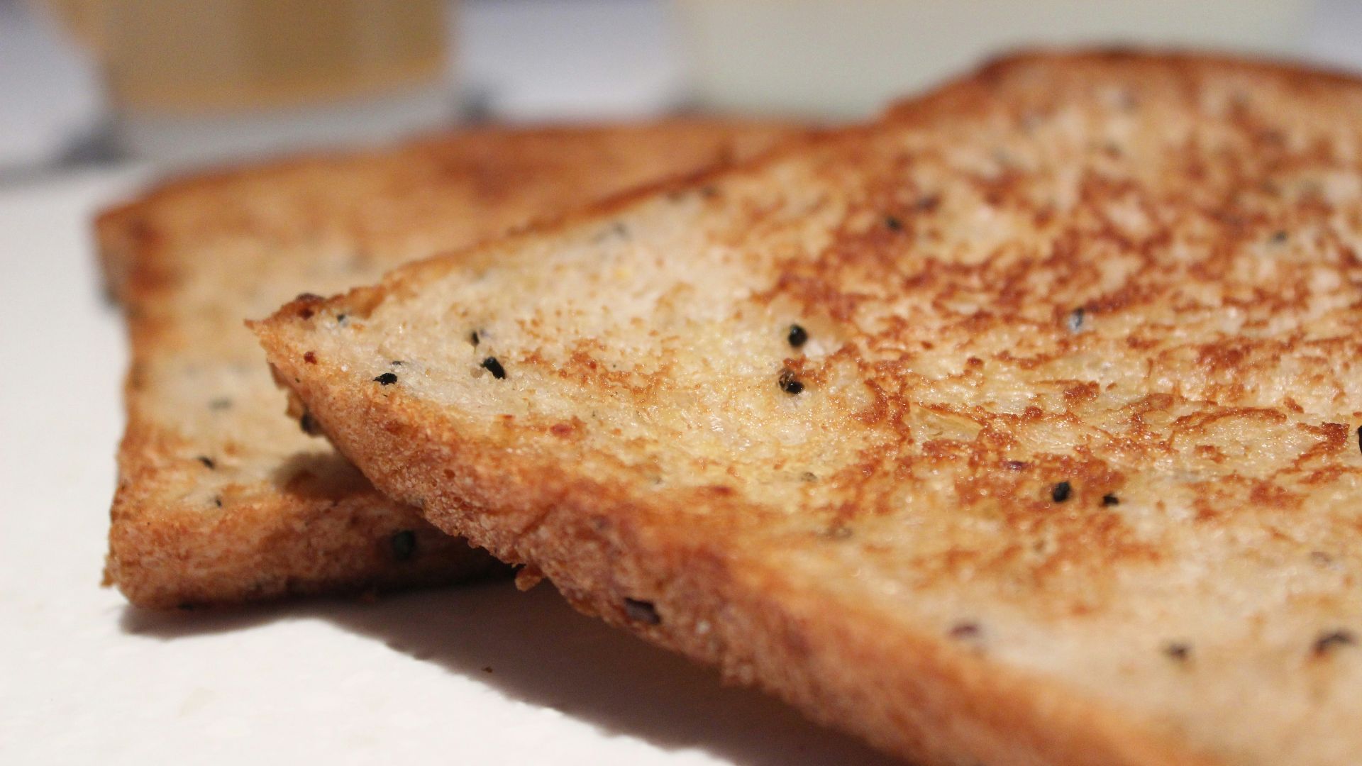 a close up of a grilled cheese sandwich on a plate