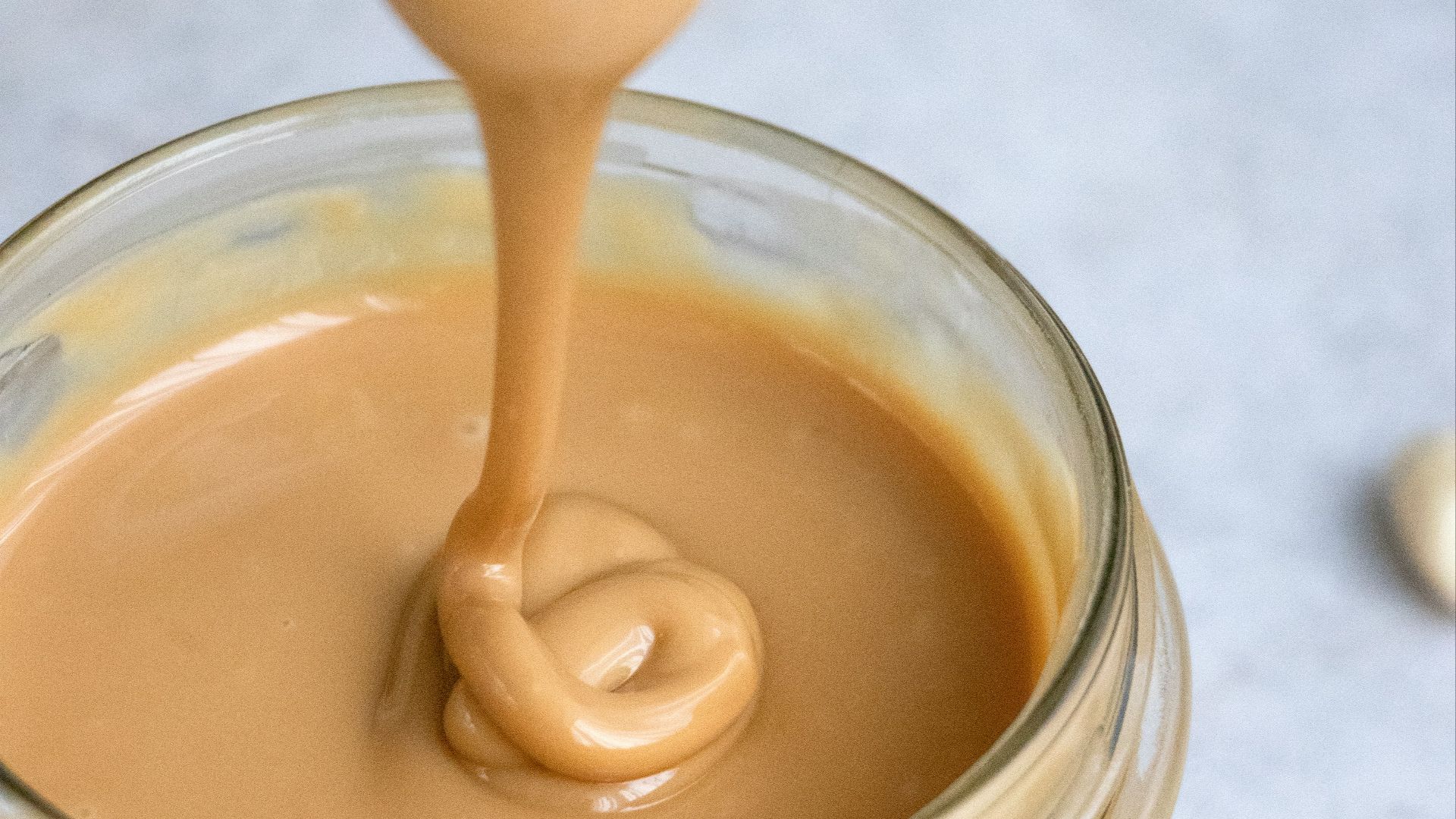 clear glass jar with brown liquid