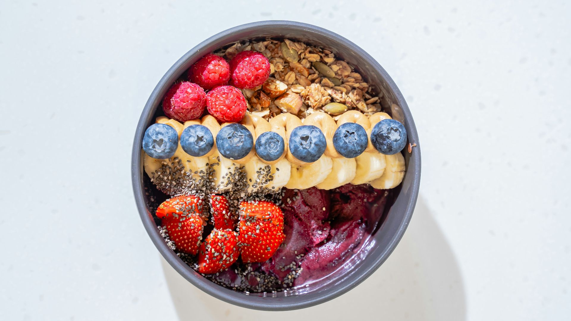 a bowl of cereal with milk and fruit