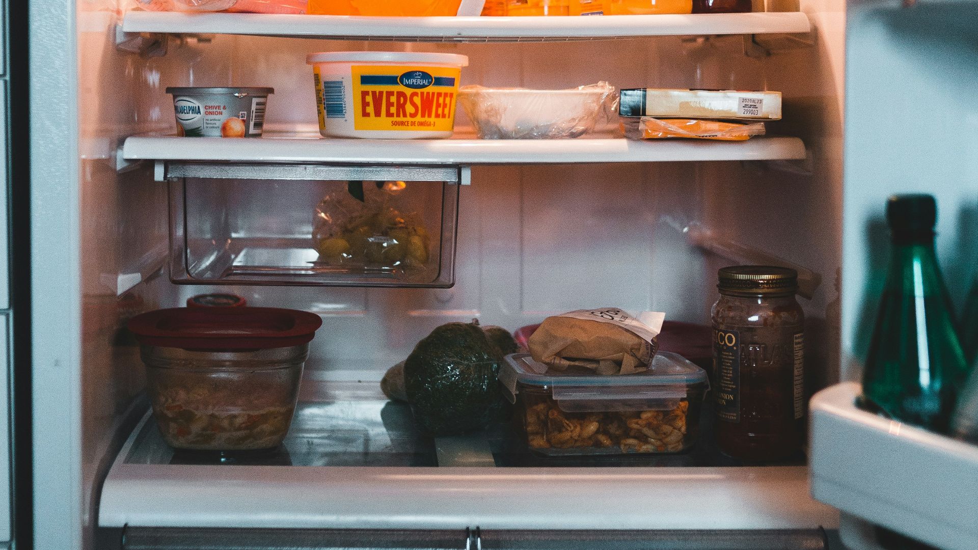 white refrigerator with assorted items