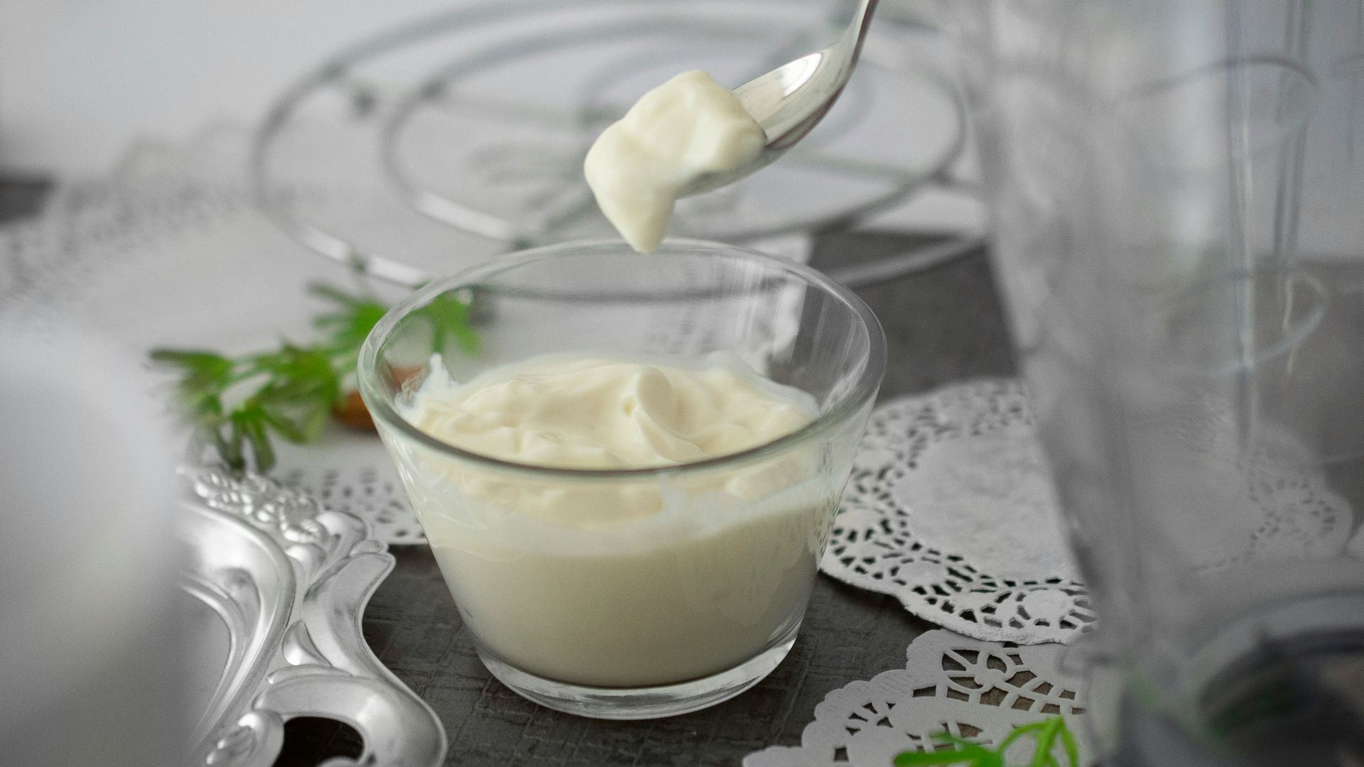 close-up photo of white cream in clear shot glass
