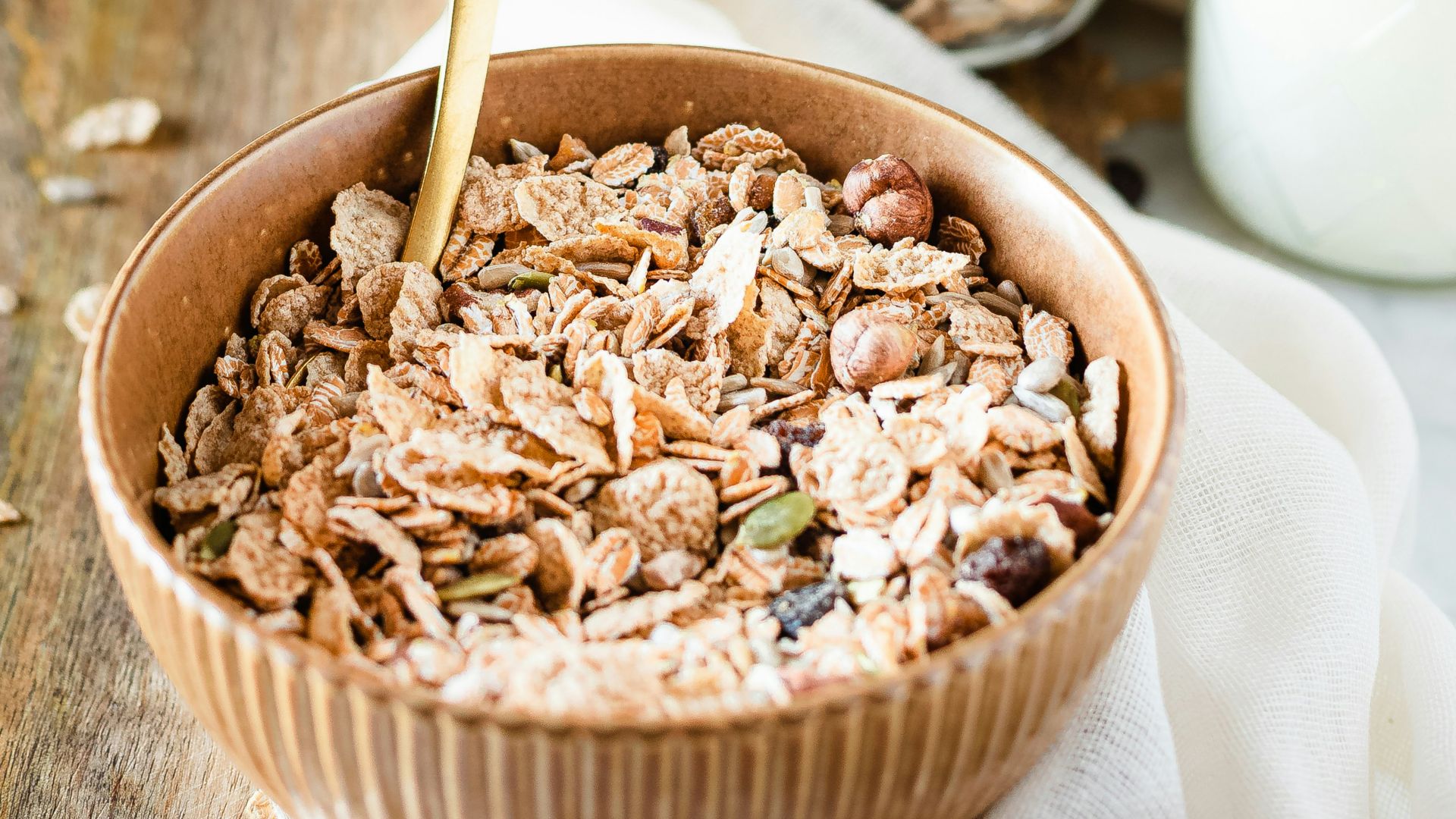 brown wooden bowl with brown wooden spoon