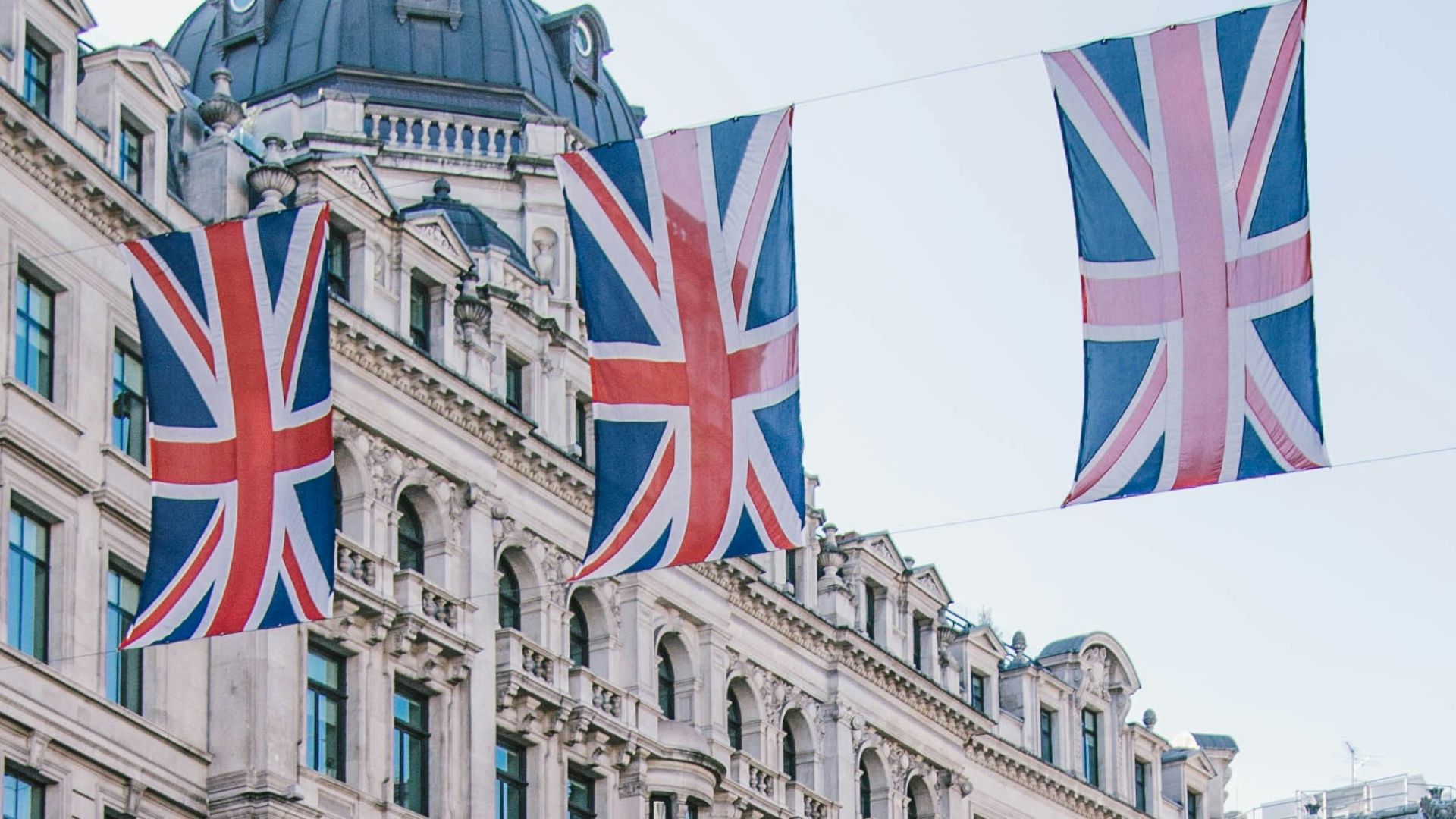 photo of car and bus near castle