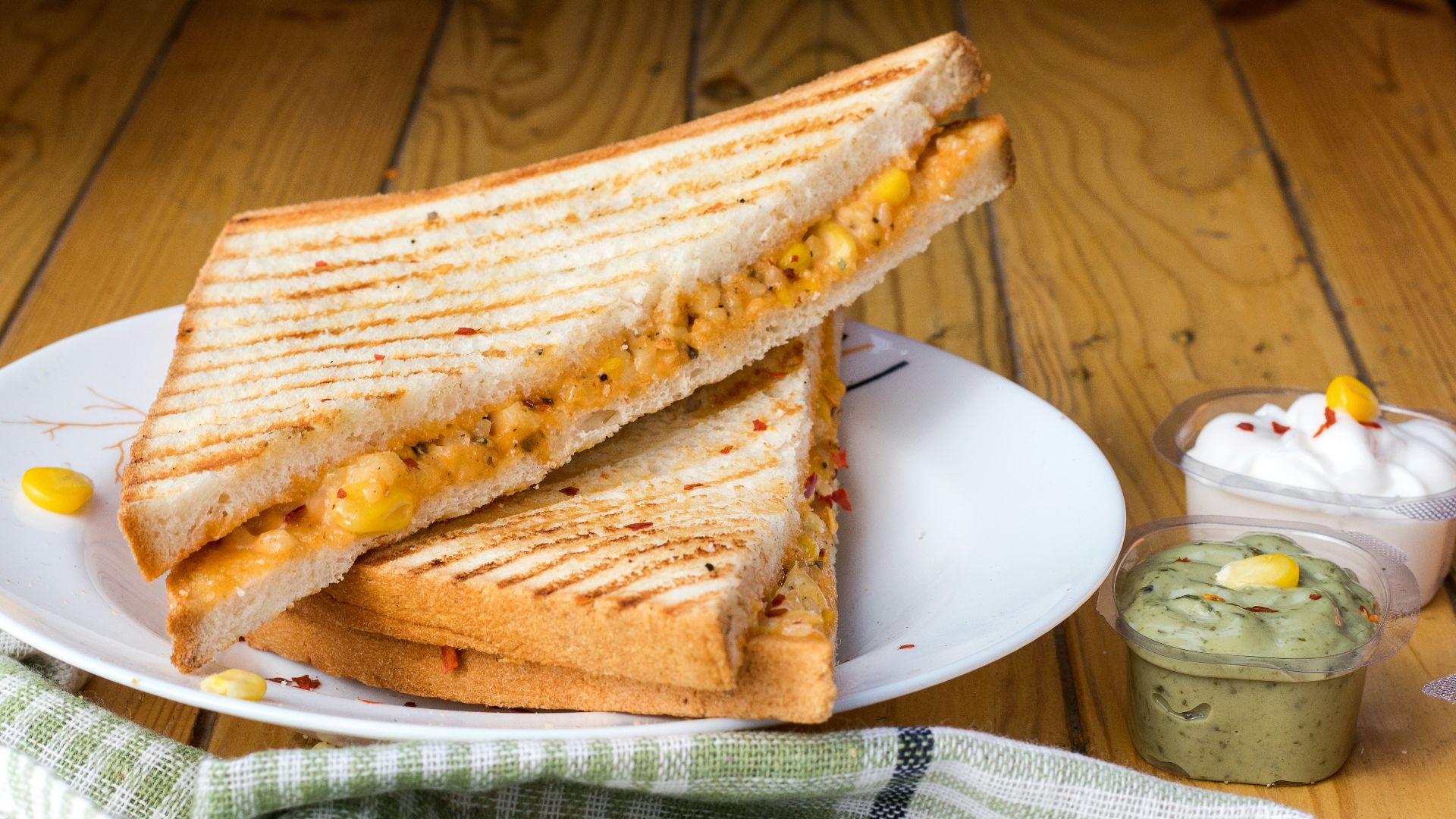 bread with cheese fillings on white ceramic plate
