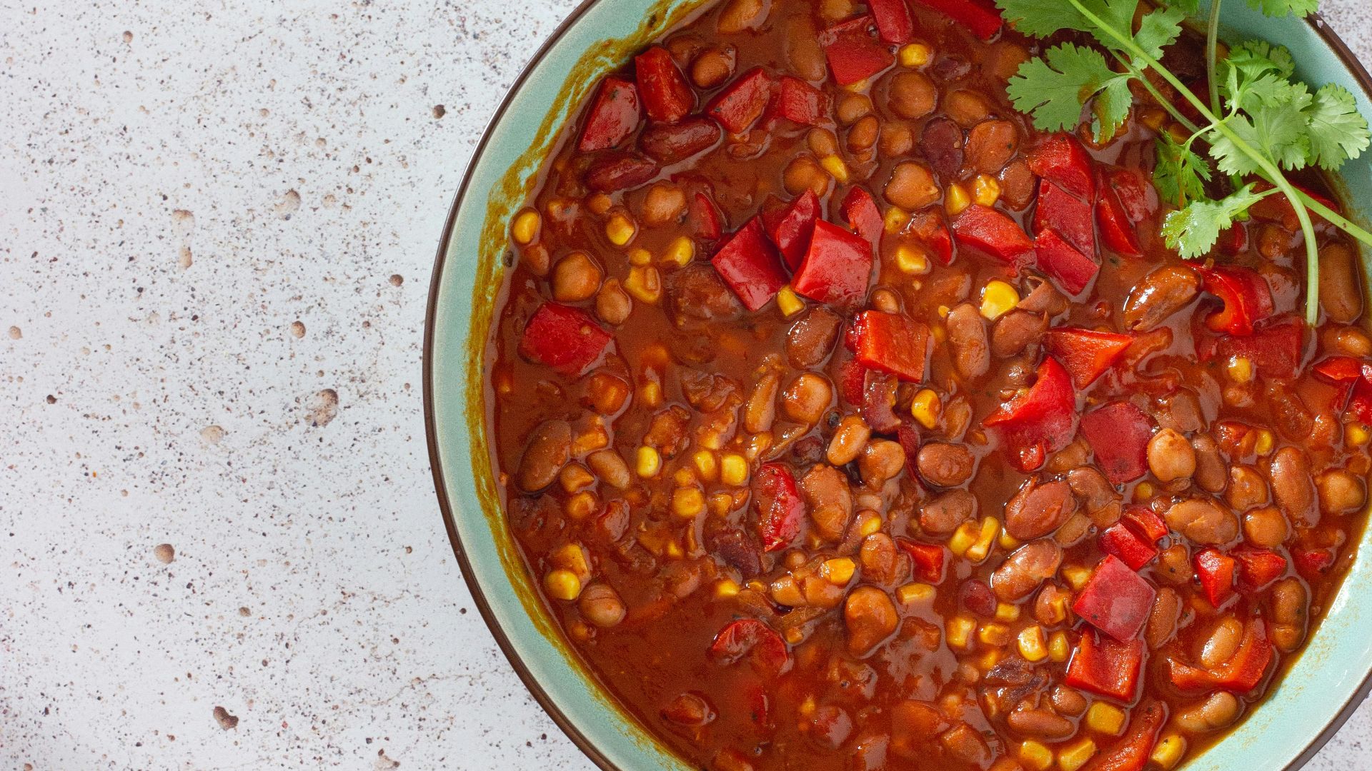 red and green chili peppers in white ceramic bowl
