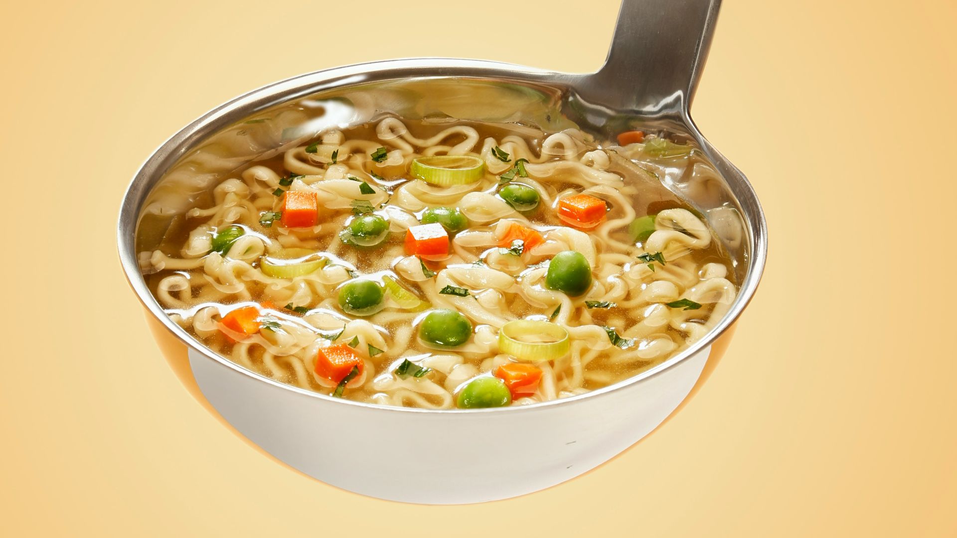 silver steel scoop with noodles