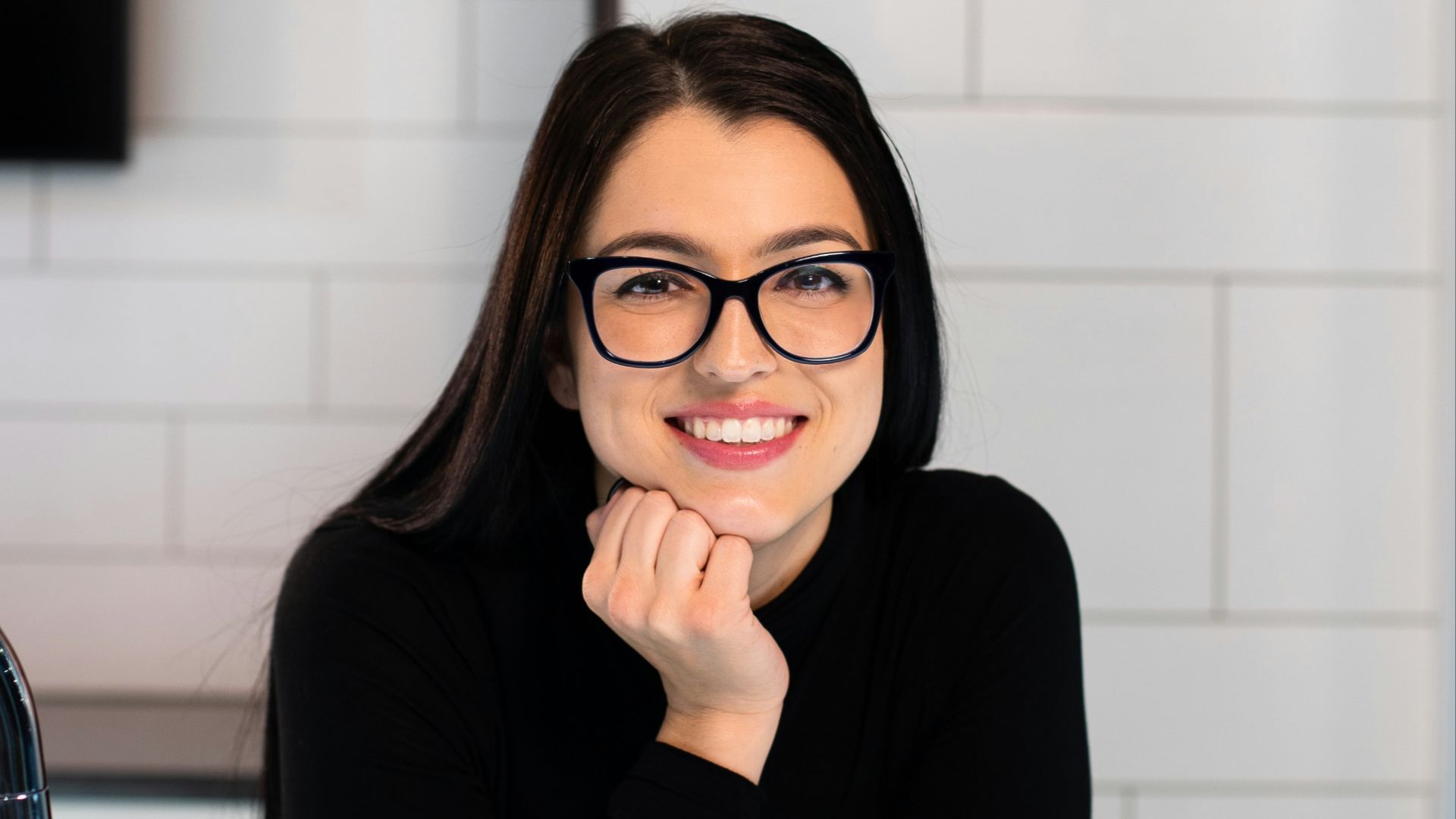 woman in black long sleeve shirt sitting on chair