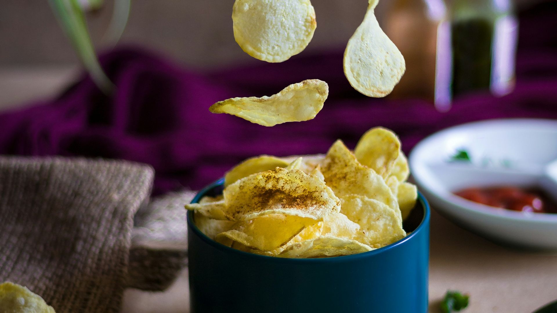 blue ceramic mug on green table cloth