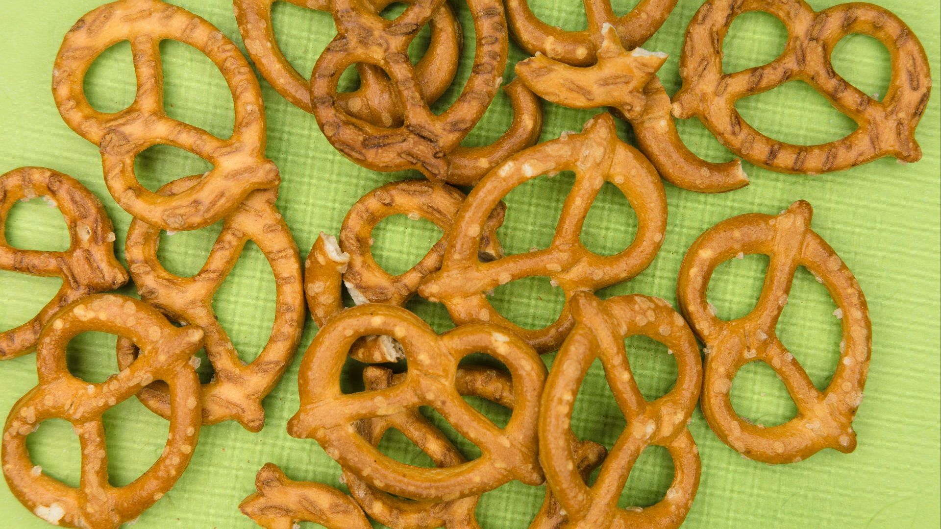 brown cookies on white and green floral ceramic plate