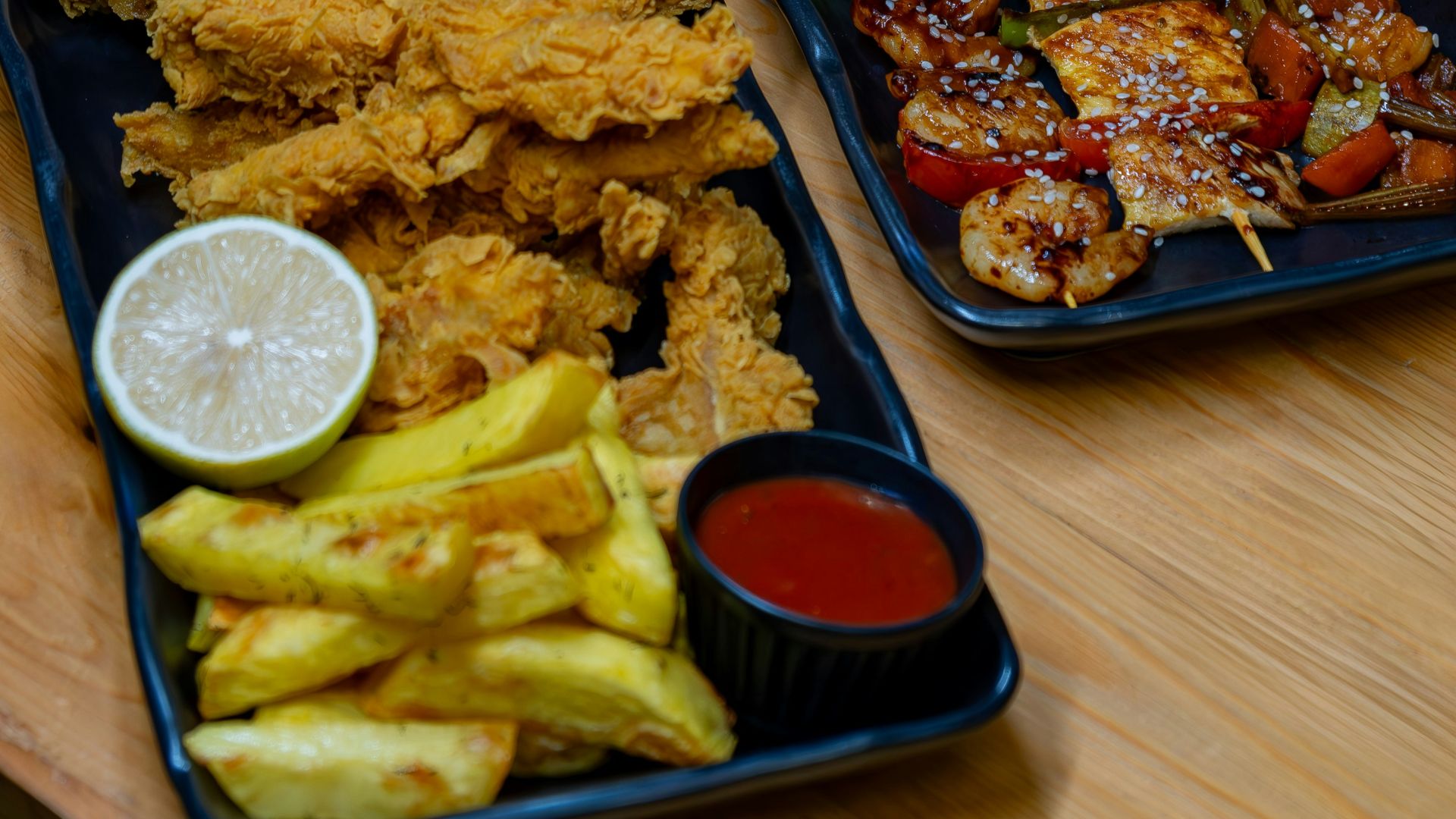 A couple of trays of food on a table