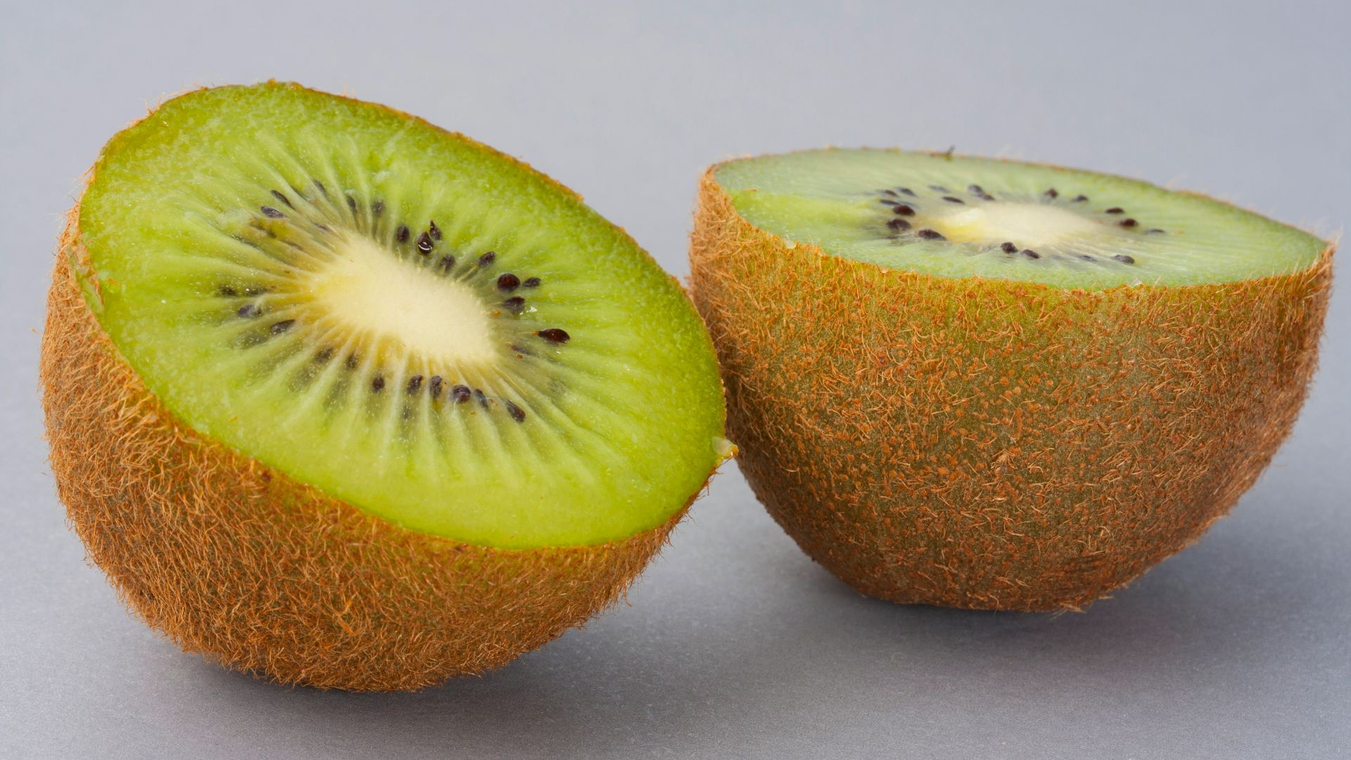 sliced green fruit on white surface