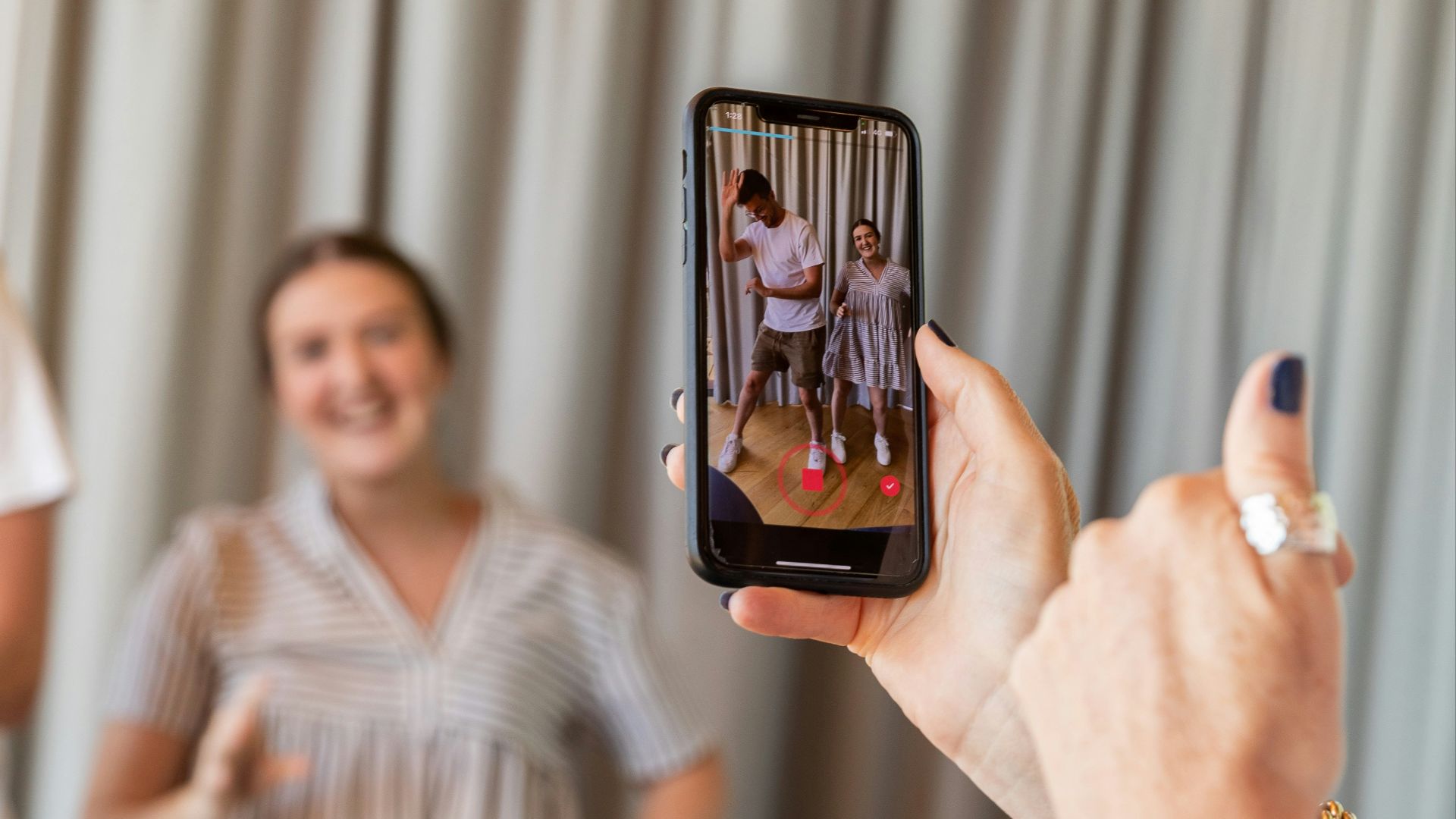 a woman holding a picture of a man