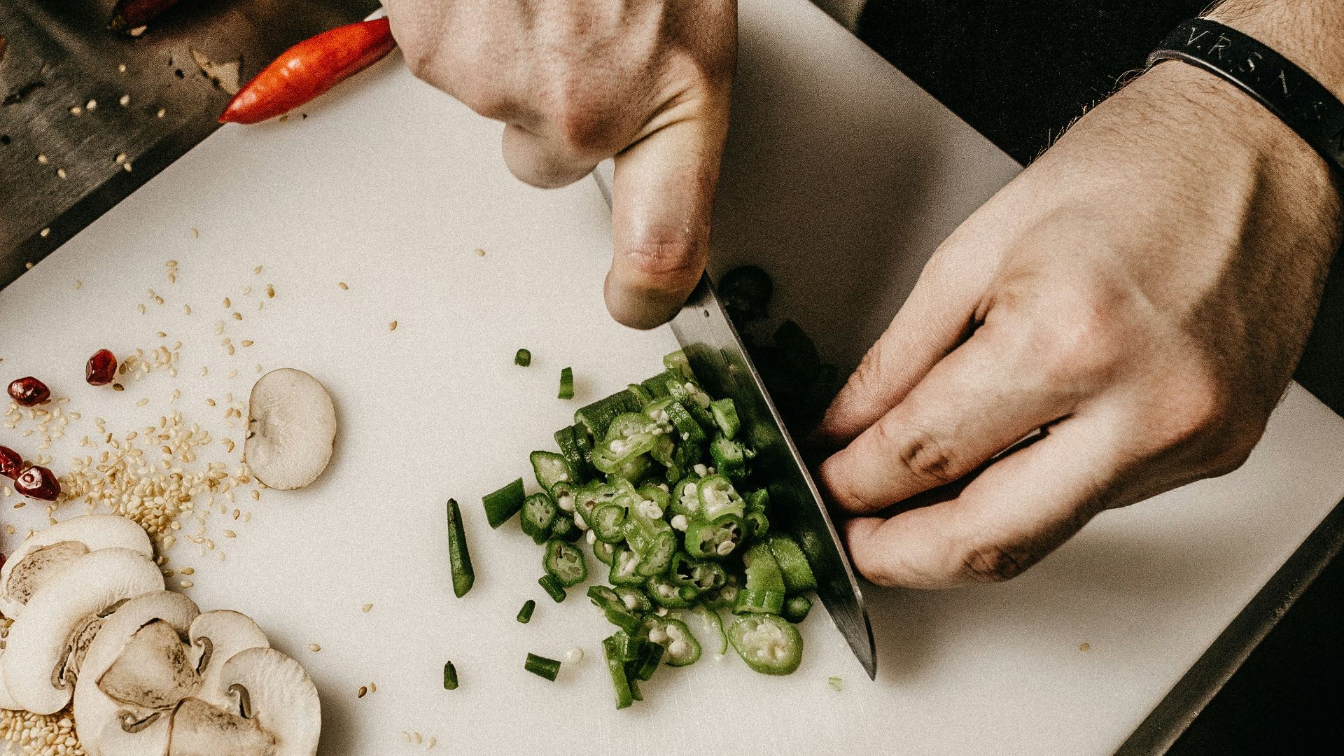 person slicing vegetable