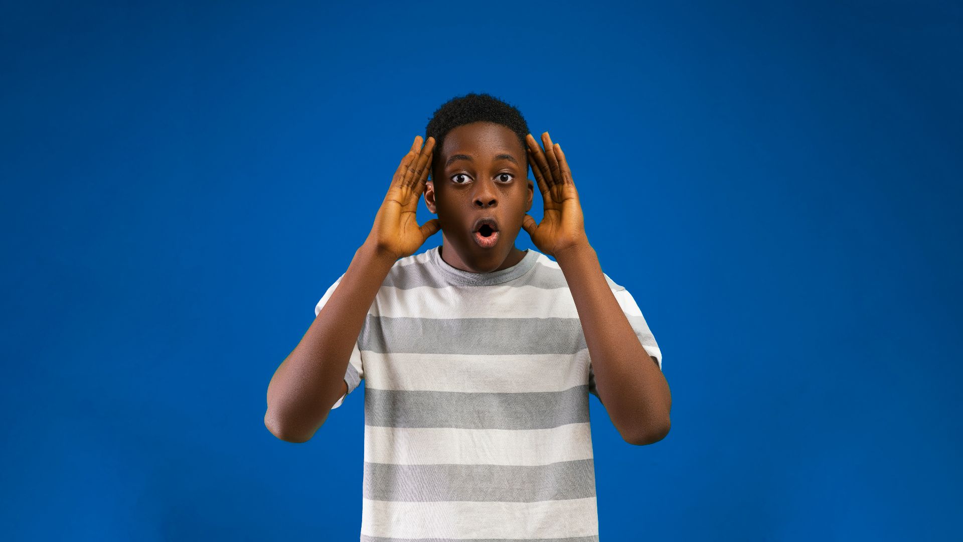 a woman with her hands on her face