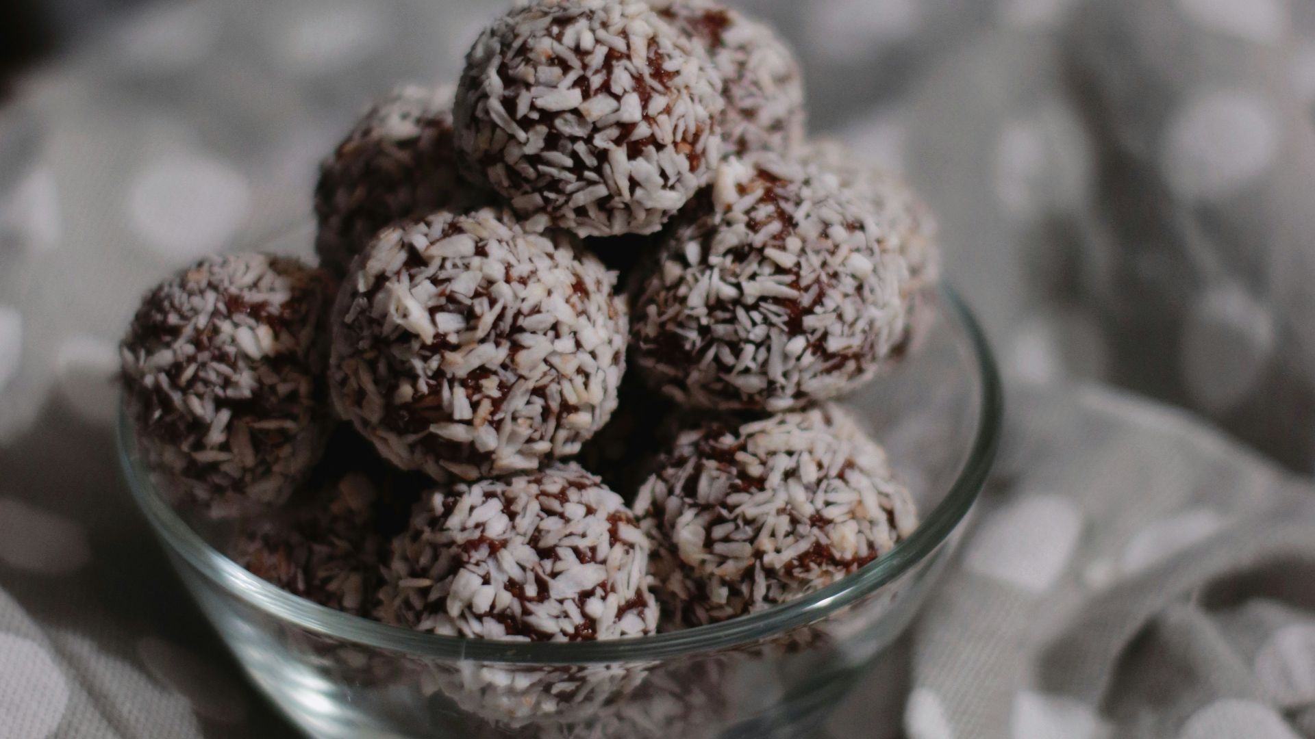 brown round fruit on clear glass bowl