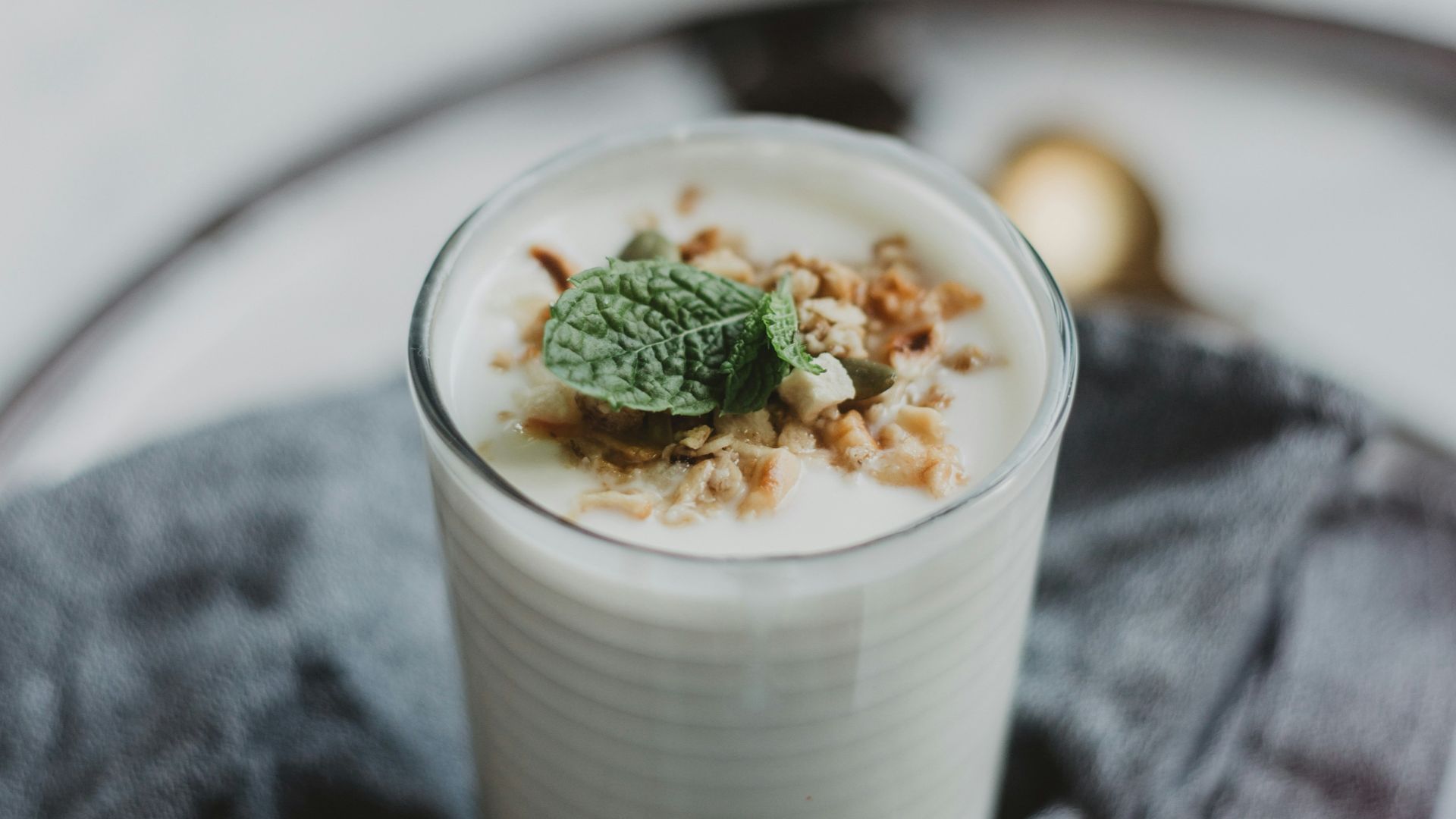 white liquid in clear drinking glass