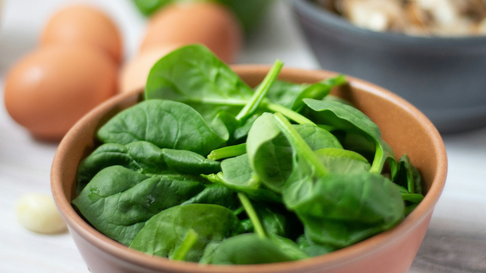 green vegetable on white ceramic bowl