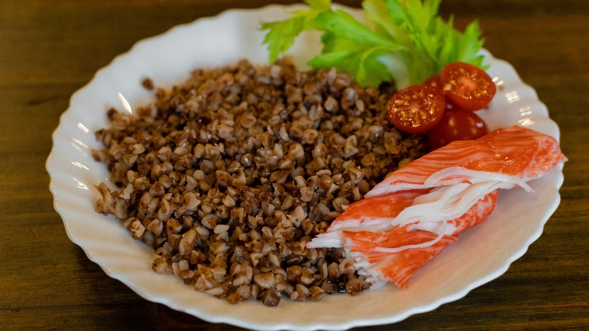 a white plate topped with meat and rice