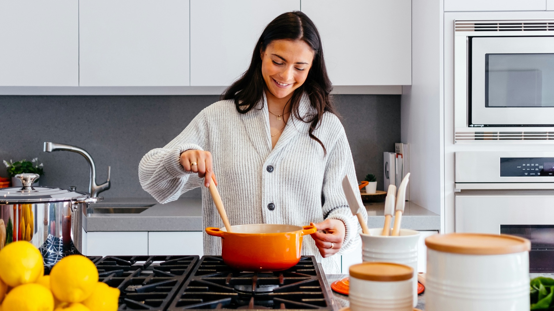 woman cooking inside kitchen room