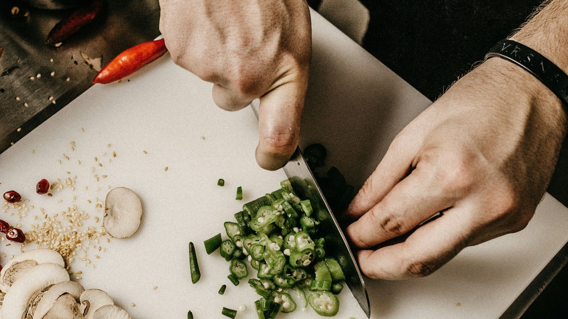 person slicing vegetable