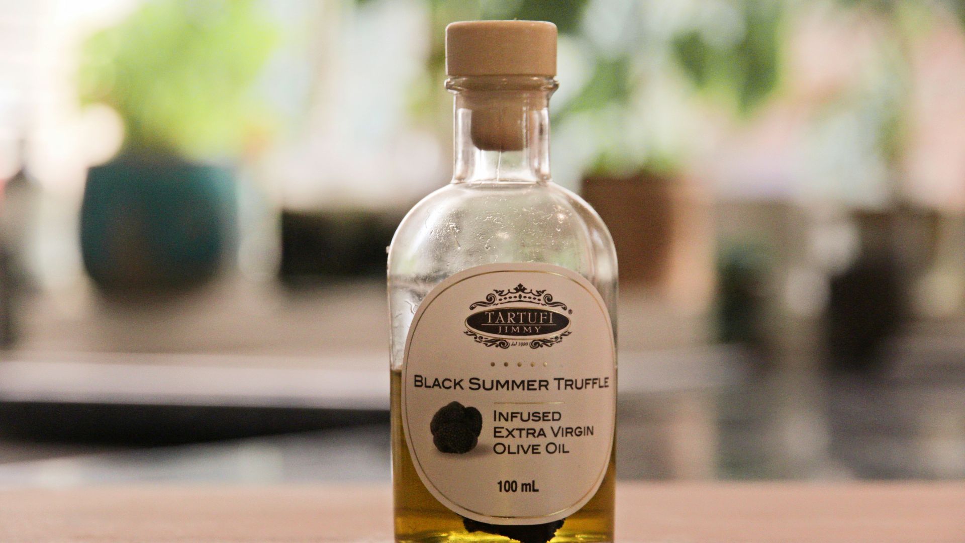 a bottle of black sesame seed oil sitting on a table