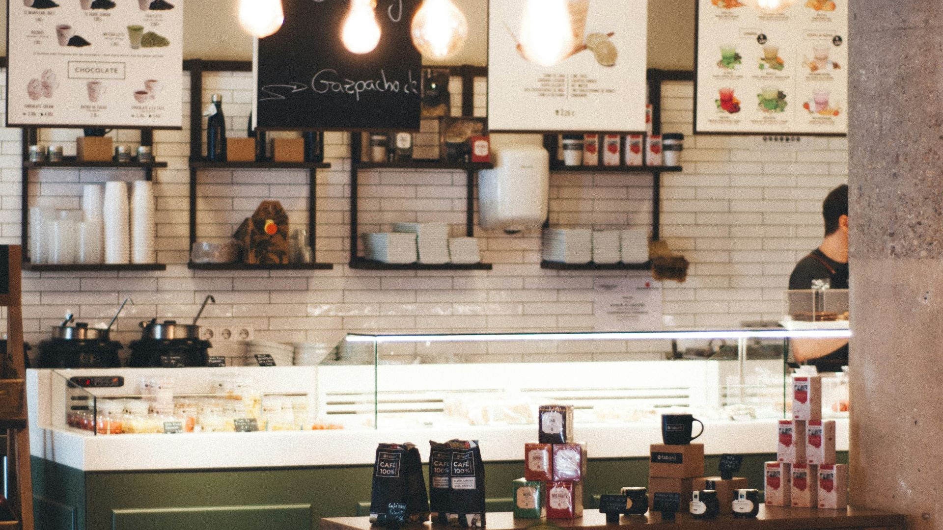 person taking picture inside of restaurant