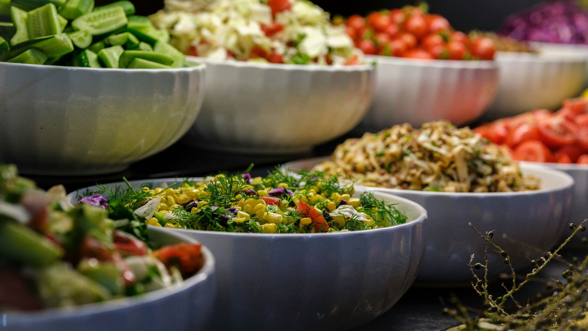 a group of bowls full of food