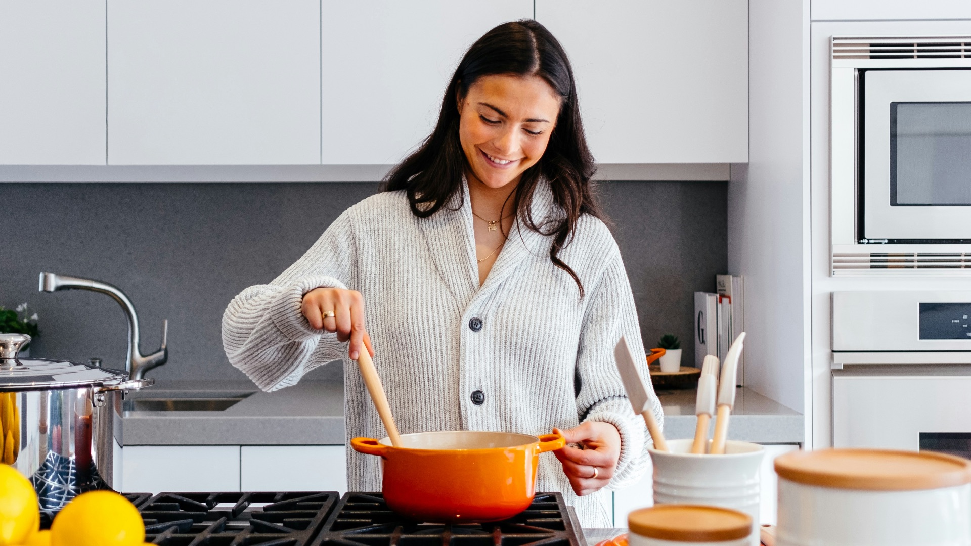 woman cooking inside kitchen room