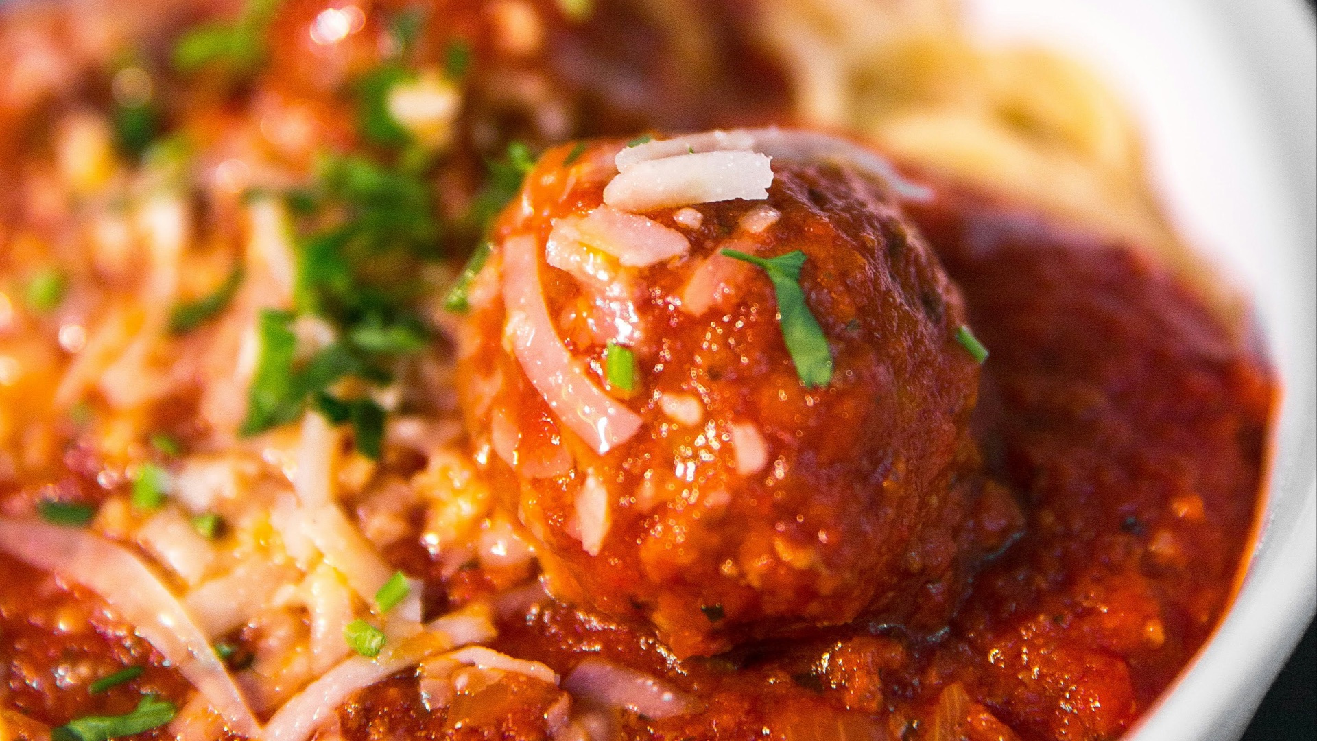 meta balls with noodles served on white ceramic bowl