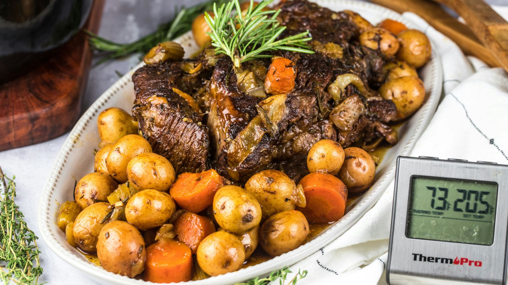 grilled meat with green vegetable on white ceramic plate