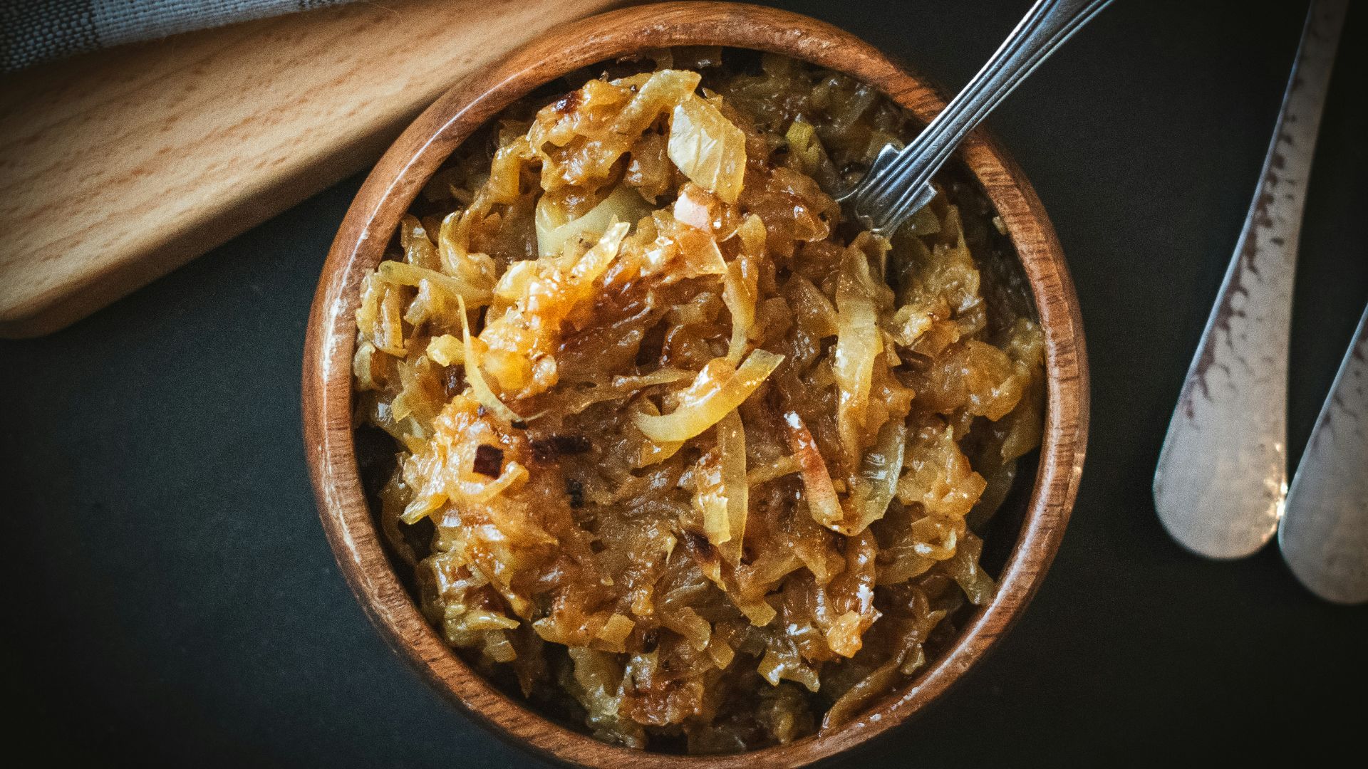 a bowl of food with a spoon next to it
