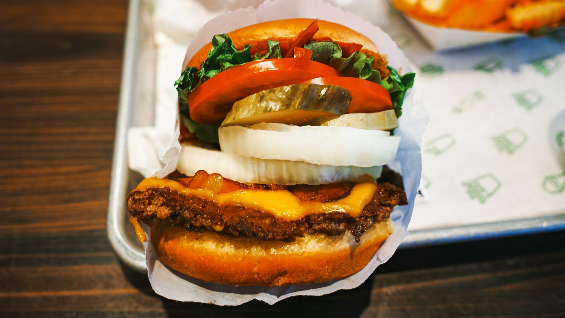 a tray with a sandwich and a bowl of fries