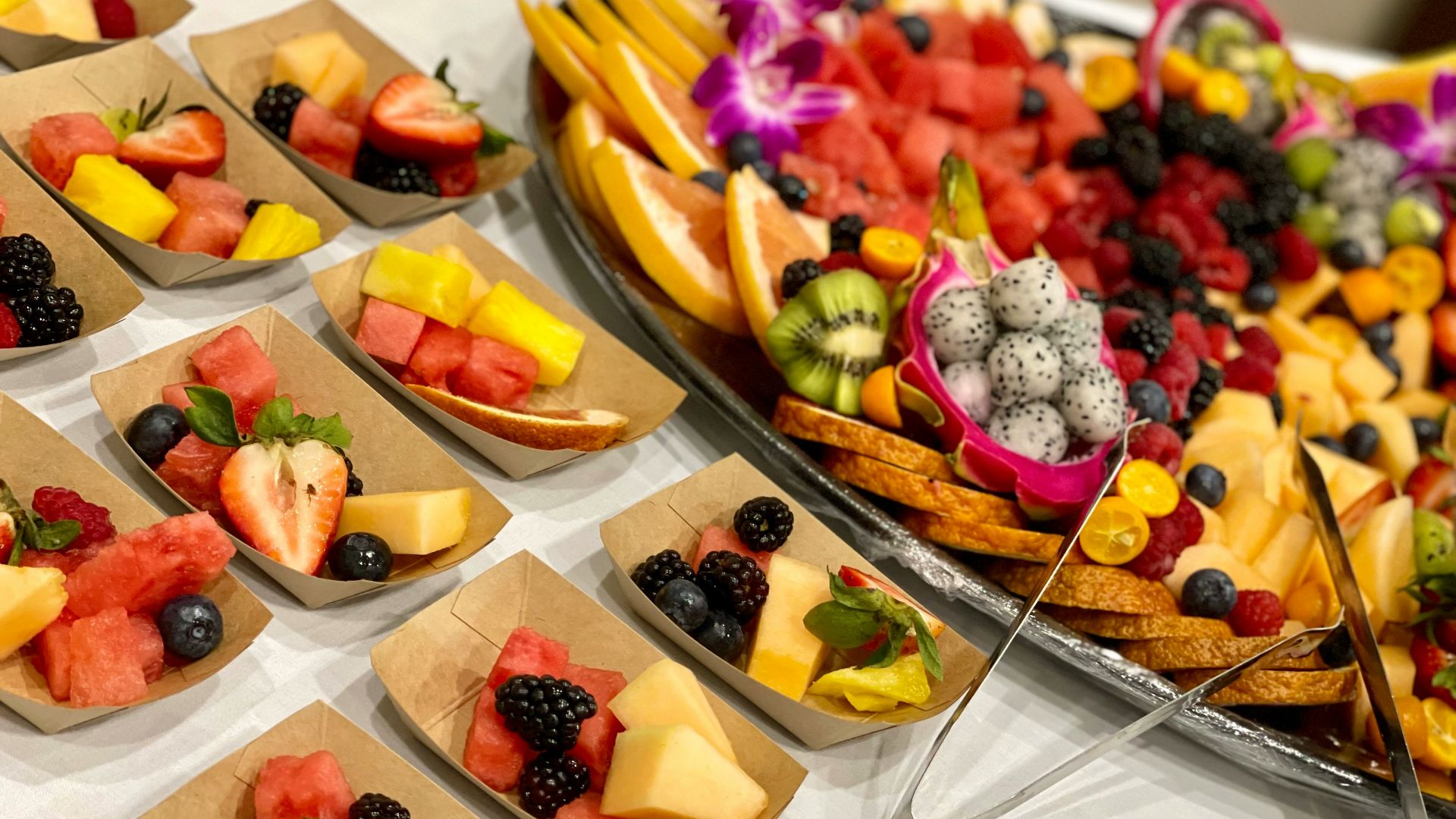 a table topped with lots of different types of fruit