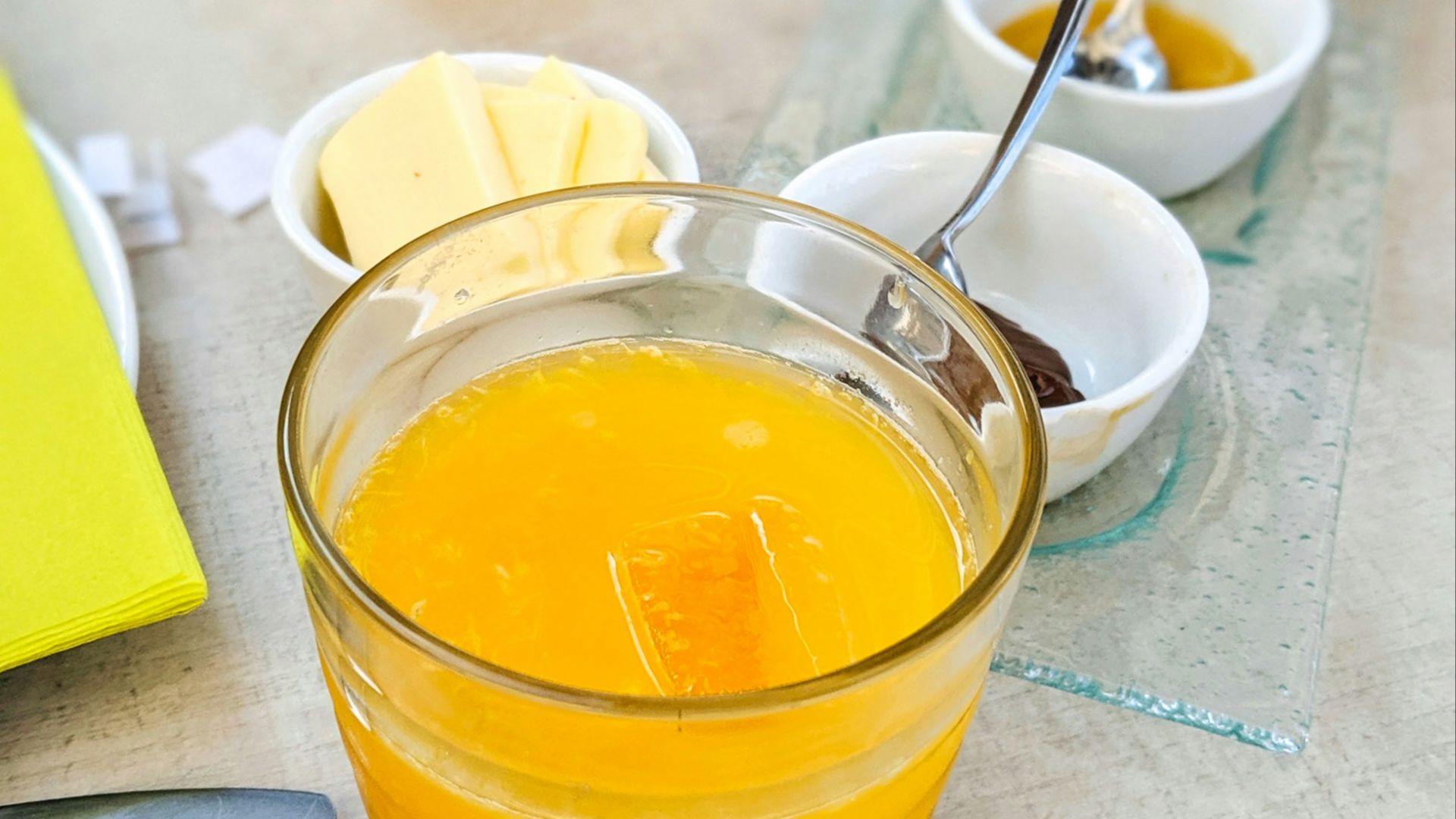 yellow liquid in clear drinking glass