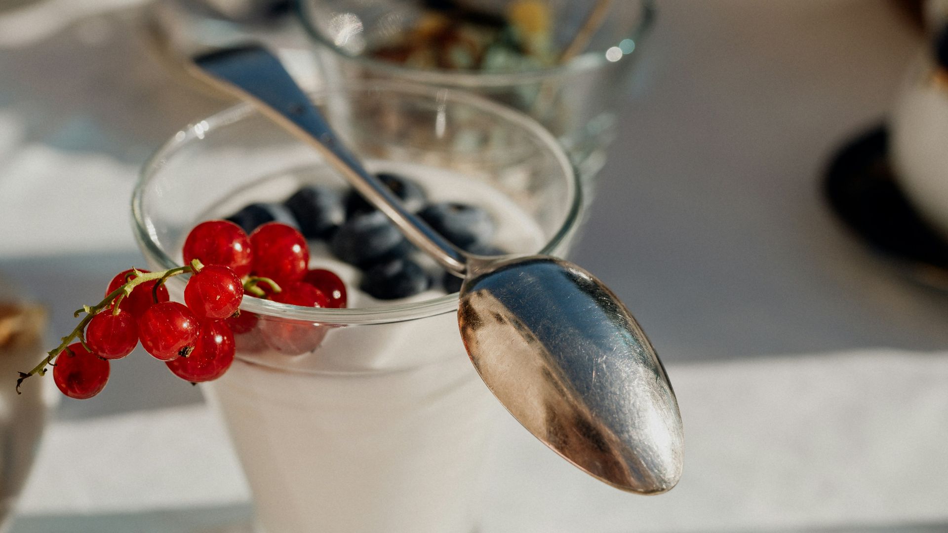a glass cup with a spoon in it and a spoon in it