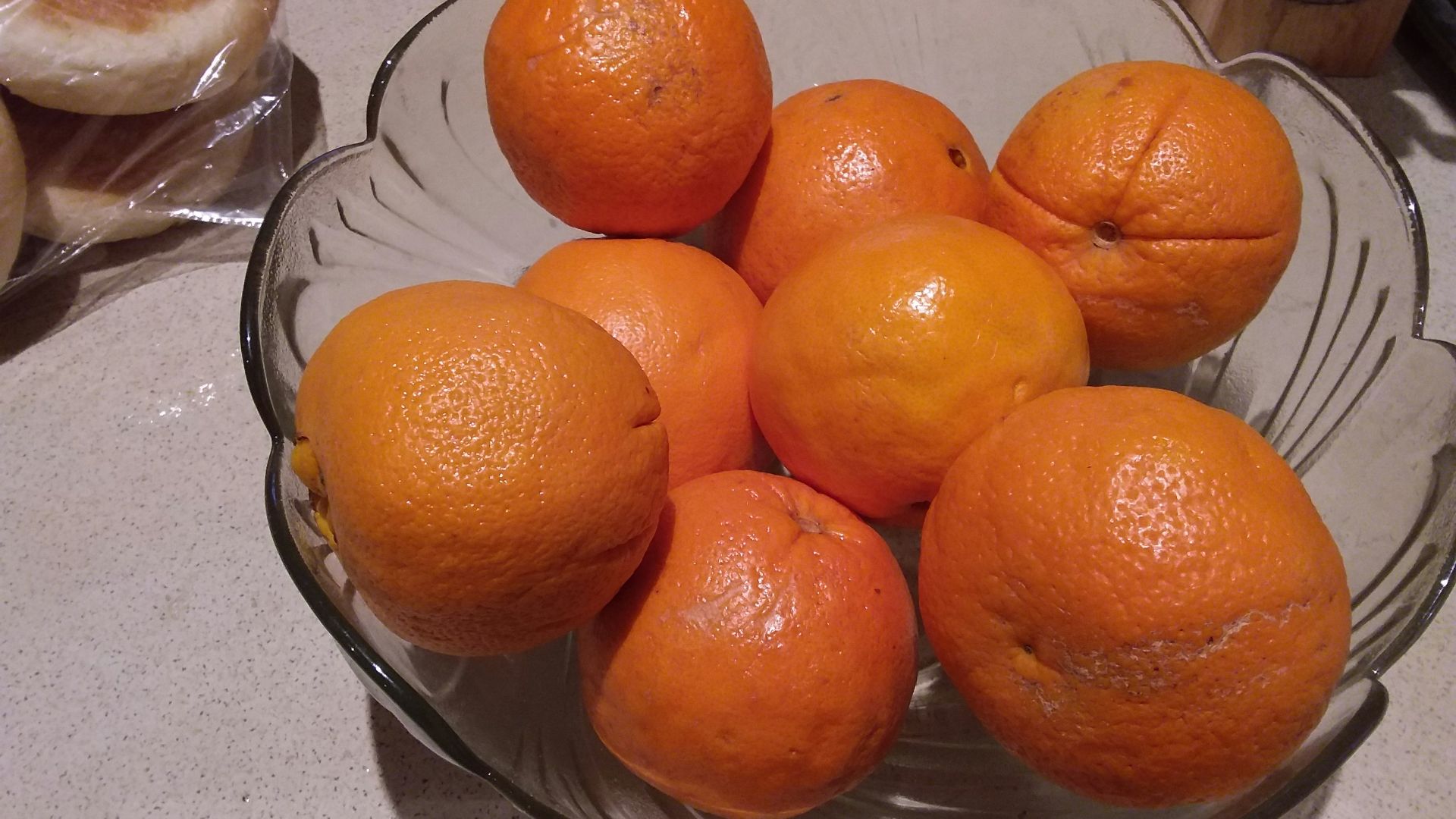 orange fruit on clear glass bowl