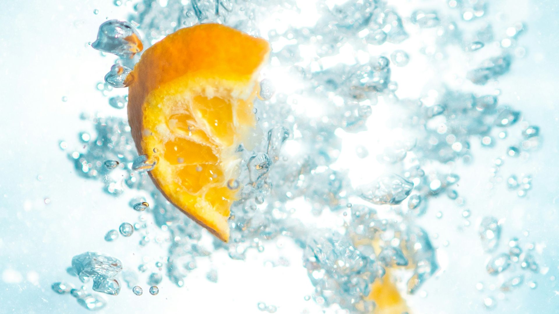 sliced orange fruits underwater
