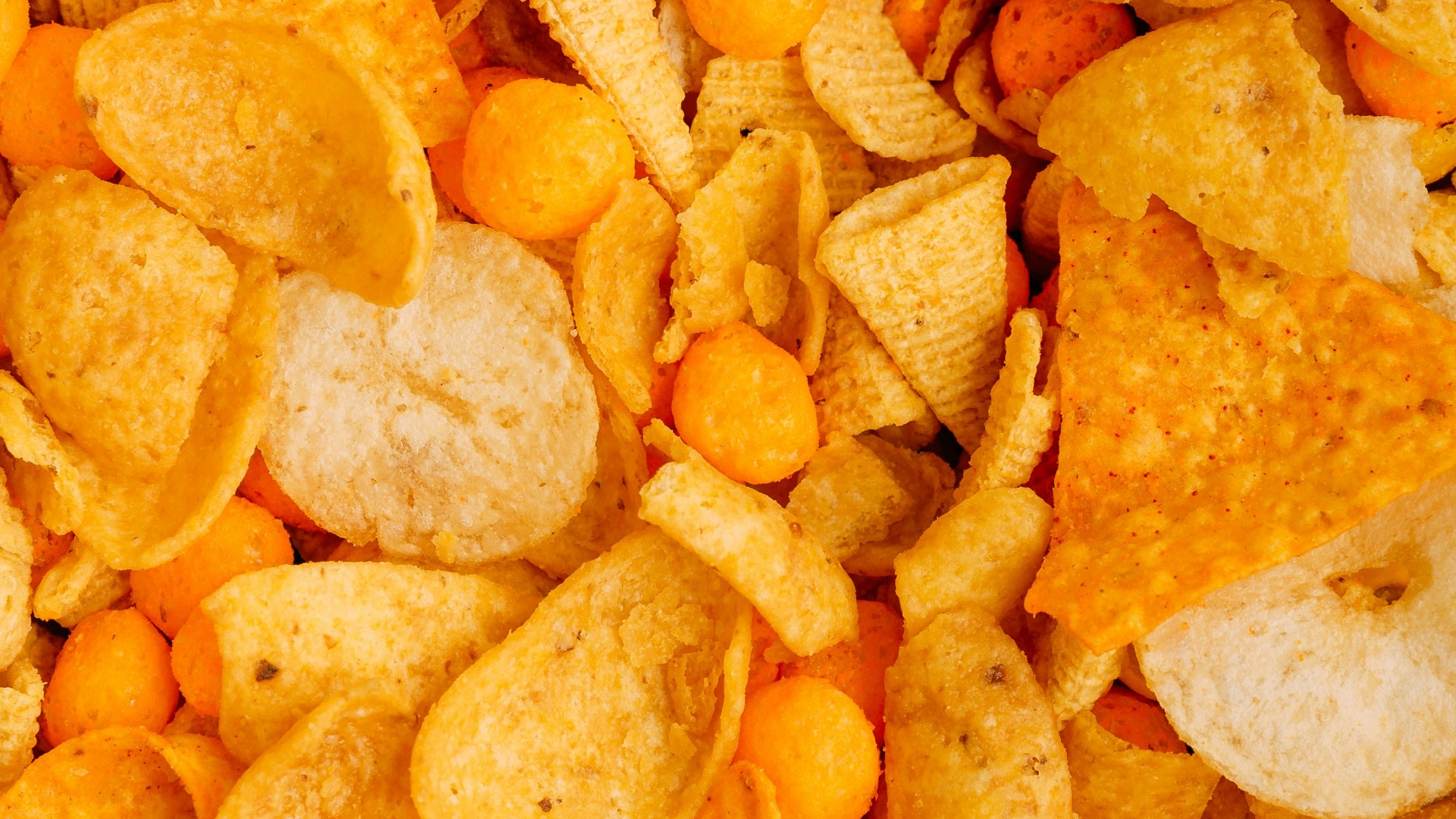 a close up of a pile of corn chips